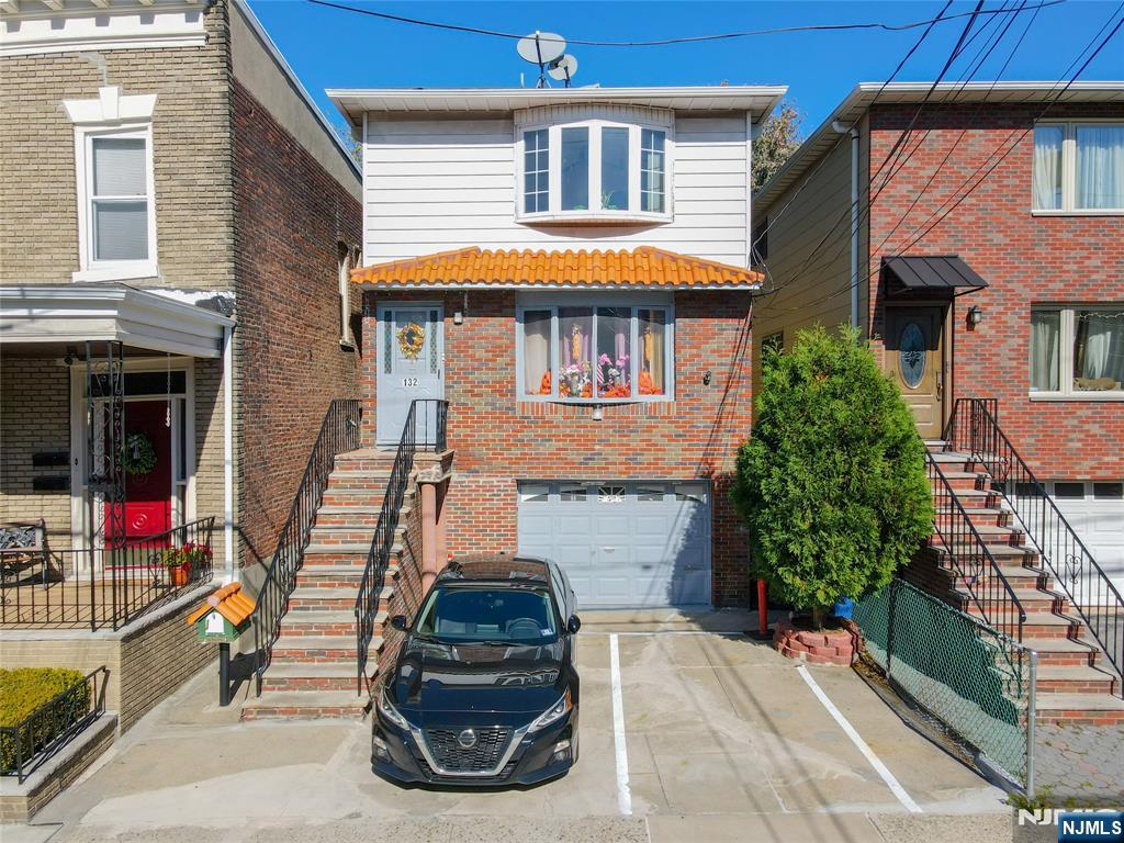 Welcome to this well-maintained two-family home just one block from Blvd East, offering an incredible opportunity for both investors and owner-occupants. Each unit features 3 spacious bedrooms and 1 full bath, providing comfortable and functional layouts ideal for modern living. The home also includes extra living space on the ground level, perfect for Related parties, a recreation area, or a home office. Enjoy the convenience of private parking and an attached garage, a rare find in this highly desirable neighborhood. Located just steps from scenic Boulevard East, residents can take advantage of stunning NYC skyline views, easy access to public transportation, shops, restaurants, and parks. Whether you're looking to generate rental income or live in one unit while renting the other, this property offers exceptional versatility and long-term value in one of North Bergen's most sought-after areas.