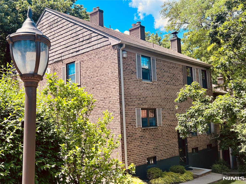 All the space of a house with none of the yard work, snow removal or outside maintenance. This 3 level corner townhouse in the sought after Inwood at Great Notch feels like your own private resort. You can chill all summer at the community pool, play on the tennis, pickleball, and basketball courts, or bring the fun to the playground. Your dog can play too in the dog park on the gounds. Step into the foyer with stairs up to the main level and down to the fun rec room, powder room, laundry, and huge storage and utilities room. The main level offers an open concept dining and living room. A tastefully updated kitchen with plenty of cabinets and stainless appliances is a cooks delight. Central AC will keep things cool all summer. Warm yourself by the woodburning fireplace all winter. The upper level features an oversized primary bedroom with double closets and an ensuite bath. And a second bedroom has a large walk-in closet with a second full bath. This unit has 1 assigned parking space, with additional open spaces avialable. Pets are allowed with board approval.The monthly fee includes your property taxes, water, heat, hot water, sewer, snow removal, maintenace of the grounds, trash removal and recycling. There is an extra fee for the pool. Conveniently located to nearby Montclair State University, museums, restaurants, and shops. Major highways and NYC train and busses a short distance away.