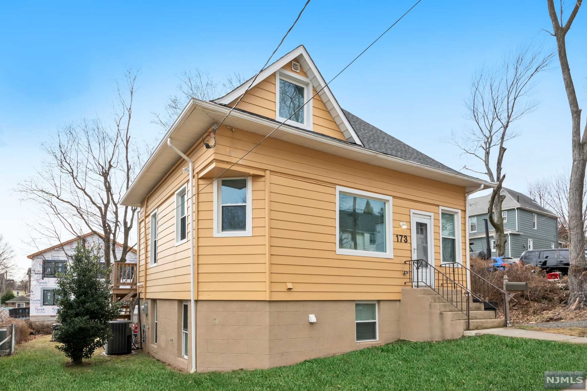 ***Completely renovated in 2019***Everything is New New New! Nice bright open floor concept. The main level offers an entry hall, Eat-in granite kitchen with stainless appliances, Dining room, full bath & family room with double sliding doors to the back deck. The second level offers 2 bedrooms, full bath, storage & laundry. The lower grade level offers a studio bedroom with ensuite bath, family room, summer kitchen and access to a large backyard! This house is fully insulated and has high efficiency units and LED lights. Plenty of room in the long driveway for many cars... Close to NYC transportation, town pool and all schools. Must see value!