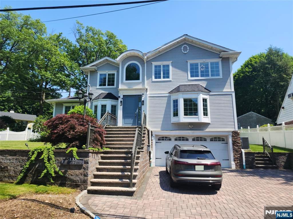 Beautifully maintained Center Hall Colonial, built in the 2010s, situated on an 85' x 100' lot in a desirable Leonia neighborhood. This spacious home features 3 bedrooms, 3 full baths, and 1 half bath with an ideal layout for comfortable living. The first floor offers a welcoming entry foyer, formal living room, dining room, den/home office, spacious family room, large eat-in kitchen, powder room, laundry area, and access to the backyard patio. Upstairs, the primary suite features a huge walk-in closet and private bath, along with two additional bedrooms, a full bath, and a convenient second-floor laundry. The fully finished ground level includes a large recreation/family room, bonus room with a walk-in closet, full bath, laundry area, and ample storage, providing flexible space for guests, a home office, or extended living. Additional features include hardwood floors, central air, multi-zone gas baseboard heat, an attached garage, sprinkler system, and municipal water and sewer. Conveniently located near schools, parks, shopping, houses of worship, and NYC transportation.