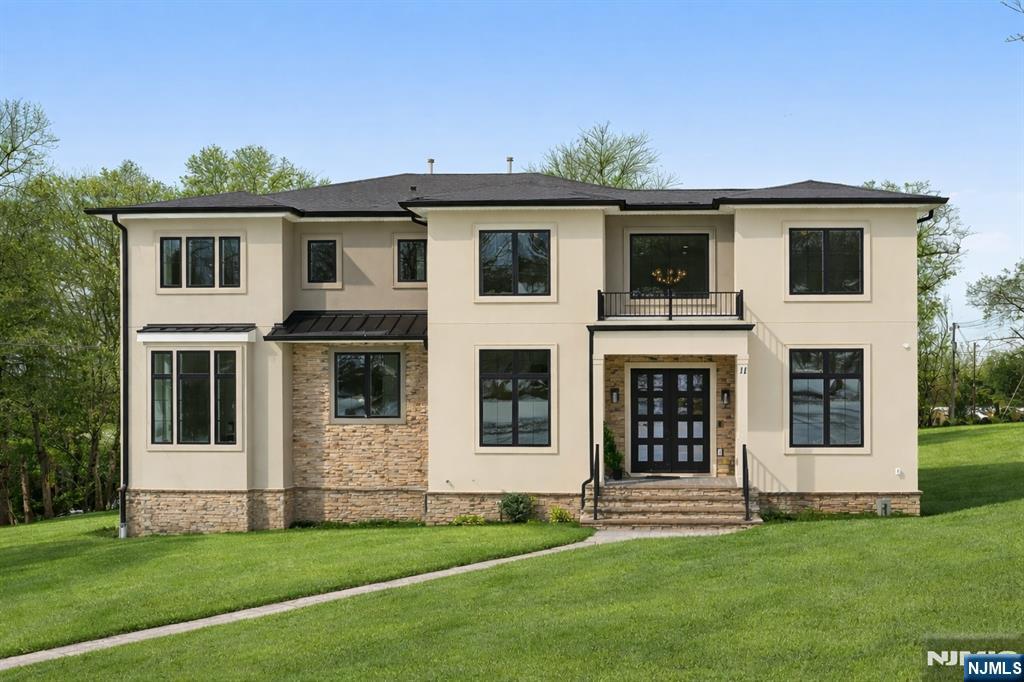 Modern Masterpiece with Timeless Curb Appeal. This exceptional NEW CONSTRUCTION Center Hall Colonial blends modern sophistication with classic architectural design in Livingstonâ€™s prestigious Riker Hill section. Set on a flat 0.58-acre lot, this 5,700+ sq ft residence makes a striking first impression with its elegant stucco and stone façade. A grand two-story foyer with marble flooring introduces sun-filled interiors defined by clean lines, custom millwork, and refined finishes. The main level features formal living and dining rooms, a private office, custom mudroom, and a first-floor guest en-suite. The chefâ€™s kitchen impresses with a waterfall quartz island, quartz backsplash, custom cabinetry, premium stainless steel appliances, walk-in pantry, and butlerâ€™s pantry with wine cooler, flowing seamlessly into the dining area. The dramatic double-height family room with fireplace and built-in speakers opens to an expansive deck for effortless indoor-outdoor living. Upstairs, the primary suite offers two custom walk-in closets and a spa-like bath with soaking tub, dual vanities, and glass shower. Three additional en-suite bedrooms and laundry complete the level. The finished walk-out basement includes a recreation room, bar, fitness room, guest en-suite, and built-in speakers. A three-car EV-ready garage and a 10-year builderâ€™s warranty complete this feature-rich offering.