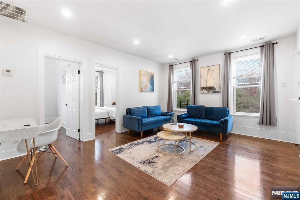 Welcome home to this beautifully renovated 2-bedroom, 1-bath apartment, offering the perfect blend of modern comfort and classic charm. Featuring stunning hardwood floors throughout, this bright and airy space is ideal for those seeking style and convenience. The updated kitchen is a standout, with ample counter space and modern finishes that will inspire your inner chef. Both bedrooms offer generous closet space, ensuring you have plenty of room for all your belongings.Located in a prime neighborhood, this apartment is just minutes from bus stops and the train station, making your commute a breeze. Enjoy easy access to all the local amenities, restaurants, and shops that make this location so desirable.