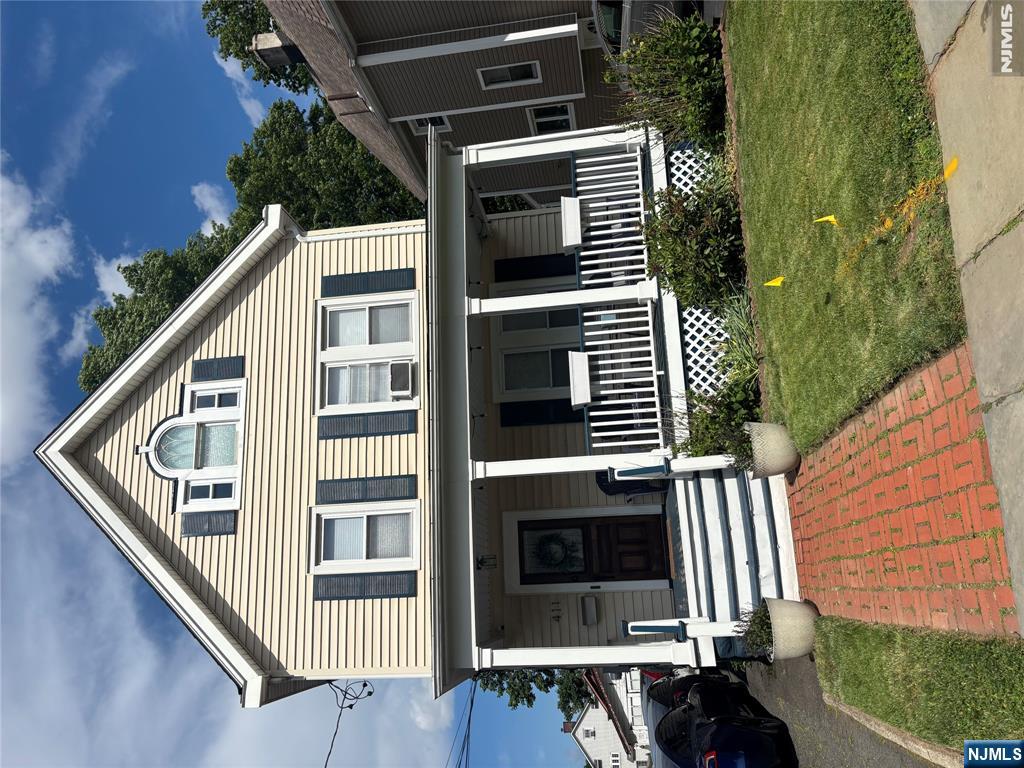 Classic two-family Colonial on a tree-lined street in Bloomfield, blending historic charm with modern convenience near the Garden State Parkway, local shops, the Montclair cultural hub and NJ Transit. Unit 1 spans the entire first floor with direct access to the large, unfinished walk-out basement featuring laundry, separate utilities, and storage. Unit 1 boasts an upgraded eat-in kitchen with durable Formica countertops, water-resistant Luxury Vinyl Down (LVD) flooring, stainless steel appliances, and subway tiles. It opens to a rear mudroom leading to the backyard (and doubles as a private entrance). The bright formal living room and main bedroom both feature original hardwood floors, while the full bath has standalone shower, glass vanity, and built-in linen storage. Unit 2 comprises the second and third floors and greets you with a large entry hallway, closet, and a spacious open-concept living/dining zone with hardwood floors, an eat-in kitchen with stainless steel appliances, a bedroom, and full bath. The third floor features a versatile "captive" flex room (ideal for an office, studio or bedroom), leading into a generous private third bedroom. Two separate driveways eliminate parking issues. One private paved driveway fits 3-4 cars; one shared driveway leads to a shared garage with 1 private for you. This lovely home has replacement windows throughout and separate utilities. Ideal for investors or owner-occupants looking for rental income. Don't miss!