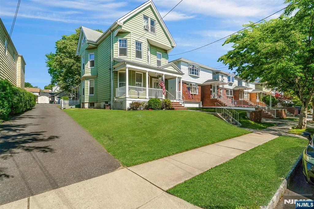 Legal 2 family w/ welcoming front porch used as a one family, layout creates flexible room uses. 2nd floor apartment= 4 bedrooms, 2 bathrooms, E-I-K dining room, living room, office & newer neutral rugs.1st floor apartment has central air, eat in kitchen, formal dining room, living room, tv room/familyrm,1 bedroom w/ walk in closet& fireplace( fireplace not warranted) hardwood floors throughout 1st floor. Ceiling fans throughout, full partially finished basement w/ laundry & utility area-,2 water heaters, 2 furnaces (baseboard heat throughout house-separate utilities for each unit(except water). The finished side has 2 rec/storage area and a1/2 bath with access to driveway/yard via hurricane doors. Large shed,& 2 car garage w/ loft storage & additional 4 car parking, large Fenced(for security & privacy) in yard w/ blacktop/patio & grassy area. Play & entertaining area.. Closing contingent on sellers securing their next home. Final & Best Monday, July 13th Guidelines uploaded