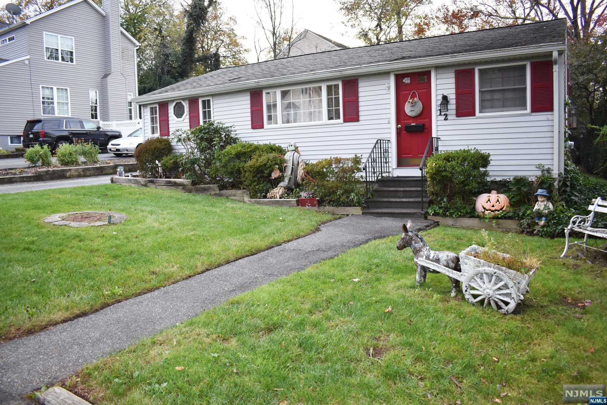 Charming- Charming- Charming!!! This 2 bedroom ranch sits up in the "indian hills" of Lincoln Park. House features glowing wood floors in Living & Dining Room. Custom built-in cabinet in Living room complete with a gas fireplace! Great location- close to both Lincoln Park & Wayne NJ transit train station, Bus stops along rt 202, OR short drive to Wayne park-n-ride. Come see what Lincoln Park has to offer!