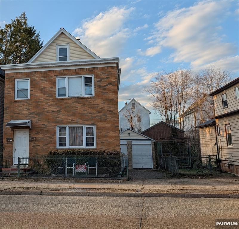Exceptional investment or owner-occupant opportunity in Garfield! Situated on a desirable double lot, this well-maintained two-family home offers a private driveway with ample off-street parking leading to a detached 2-car garage. Each unit has separate utilities and benefits from newer roof, windows, and carpeting. The first-floor apartment features 1 bedroom, while the second-floor unit offers 2 bedrooms plus finished 3rd-level bonus rooms, ideal for additional living space, home office, or recreation. Walkout basement provides added storage and functionality. Tenant occupied and being sold as-is. Perfectly located for commuters, just minutes from NJ Transit train and bus service with convenient access to Routes 46, 80, 21, and the Garden State Parkway, making travel to NYC and surrounding areas a breeze. Close to shopping, restaurants, schools, parks, and local amenities. Whether you're looking to expand your investment portfolio or occupy one unit while generating rental income from the other, this versatile property offers outstanding potential in a prime Bergen County location.