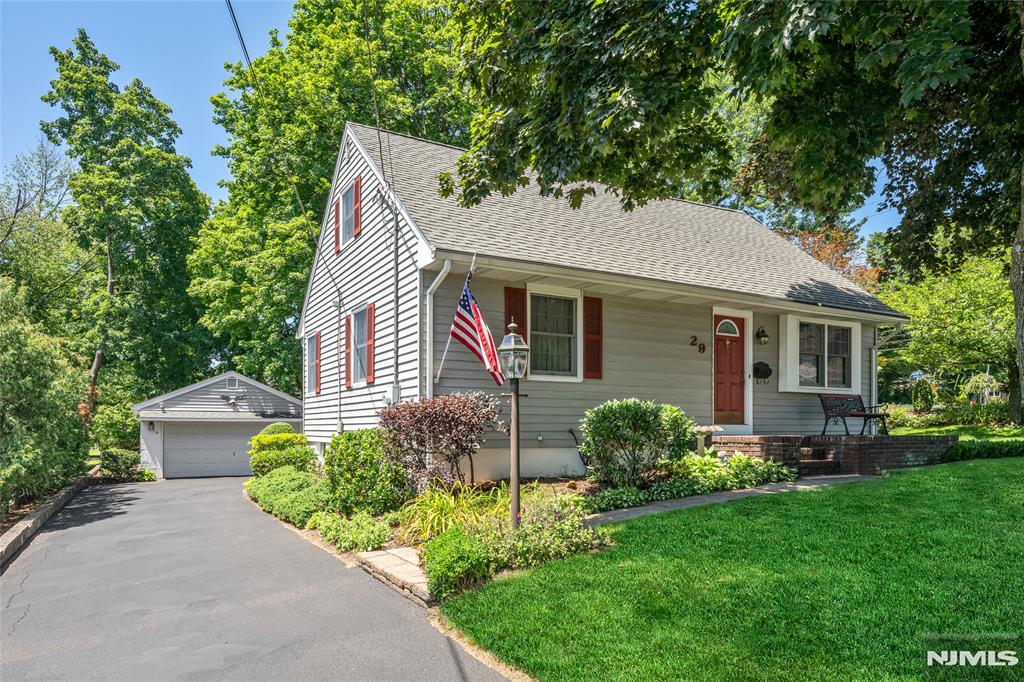 Beautifully maintained & thoughtfully detailed, this exceptional home offers timeless charm, generous living space & an unbeatable commuter-friendly location. The showstopping rear addition features walls of windows overlooking the backyard, filling the space with natural light & creating the perfect setting for relaxing or entertaining. Inside, you'll find hardwood floors, inviting living & dining areas, & a flowing floor plan designed for today's lifestyle. The kitchen offers abundant cabinetry, generous workspace & seamless access to the main living areas. The generously sized bedrooms provide comfort & flexibility, including a spacious primary bedroom with excellent closet space. The finished lower level is equipped with surround sound, making it ideal for a media room, recreation space, home office or fitness area. Outside, enjoy a spacious backyard, patio & the convenience of a detached two-car garage. Ideally located just minutes from Whole Foods, Trader Joe's, shopping, dining, parks & NJ Transit, with quick access to major highways & NYC transportation. Combining natural light, flexible living spaces & an outstanding location, this home truly has it all.