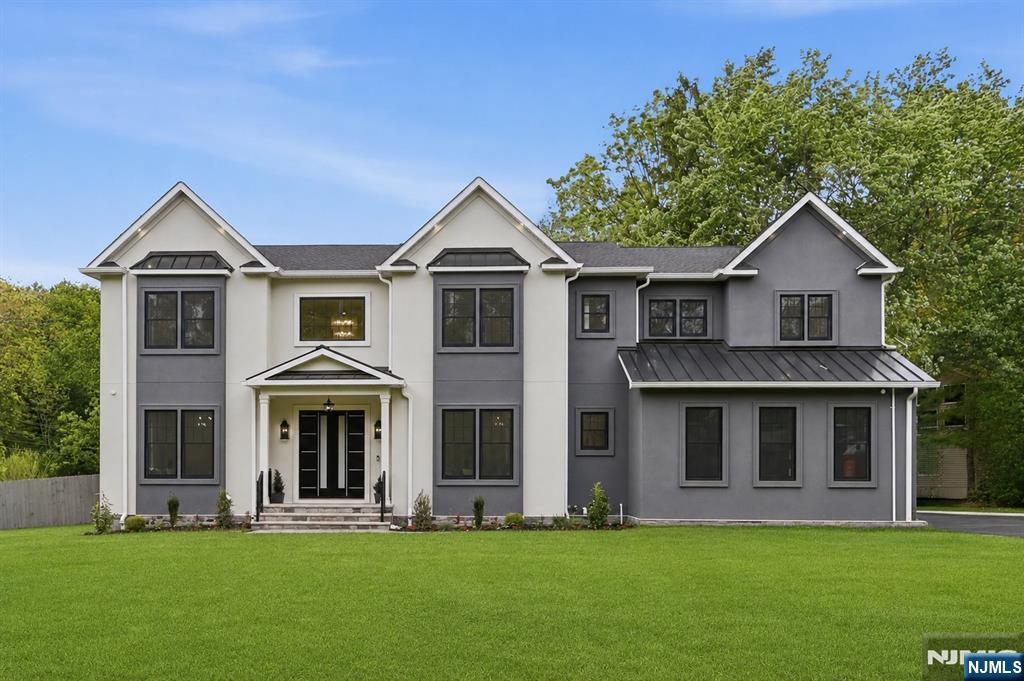 Exquisite NEW CONSTRUCTION in the coveted Deerfield section of Short Hills set on nearly 1/2 acre, offering 6 BRs, 6.5 BAs & approx. 6,700 sq ft across 3 finished levels.This modern Colonial showcases a striking stucco fa ade w/ premium stone, shingle siding & sleek Hardie panels.A dramatic double-door entry opens to a 2-story foyer w/ herringbone marble floors,10-ft ceilings, concealed LED lighting, custom millwork & oversized black-framed Anderson windows, flanked by formal LR & DR.The sunlit FR features soaring 20-ft ceilings, built-in speakers & custom-tiled fireplace,flowing into the chef's kitchen w/ paneled Sub-Zero appliances, oversized Sandborne quartz island & matching backsplash, dbl wall ovens, walnut cabinetry w/ glass uppers, WIP, butler's pantry w/ paneled wine cooler & breakfast area opening to the flat backyard w/ room for a future pool.Main level also includes a private ensuite BR w/ WIC,designer PR & mudroom w/ custom built-ins & direct access to the 3-car garage.The 2nd level w/ 9-ft ceilings features a luxurious primary suite w/ tray ceilings, dual WICs & spa-like BA w/ oversized designer tile.3 additional ensuite BRs w/ tray ceilings & WICs, plus laundry rm & private office w/ glass doors, custom wood ceiling & built-ins.Finished LL includes custom bar, theater rm, rec rm,built-in speakers & guest ensuite.Smart thermostats,Ring security & 10-yr builder warranty complete this exceptional home near top-rated Millburn Schools, downtown & NYC transportation.