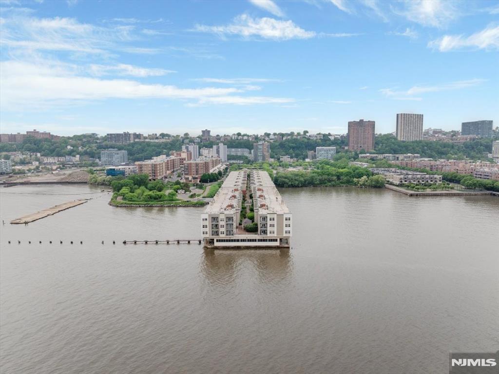 A spacious luxury condominium located within "The Promenade" complex, a premier waterfront community situated on a pier along the Hudson River. This 3 bed 2 bath home has the best views of Southern Manhattan Skyline with a nice balcony. The unit is a 3-bedroom, 2-bathroom residence encompassing approximately 1,751 square feet of livable space. Very well maintained unit ready for your personal touches with very spacious kitchen, living room and bedrooms. Residents can use a health club with a glass-enclosed exercise room, sauna, steam shower, and hot tub. The complex is a gated community with a 24-hour attended gatehouse and on-site maintenance. The building is highly walkable, located adjacent to City Place at the Promenade, and great commute to NYC and other highways. Unit comes with deeded parking space too.