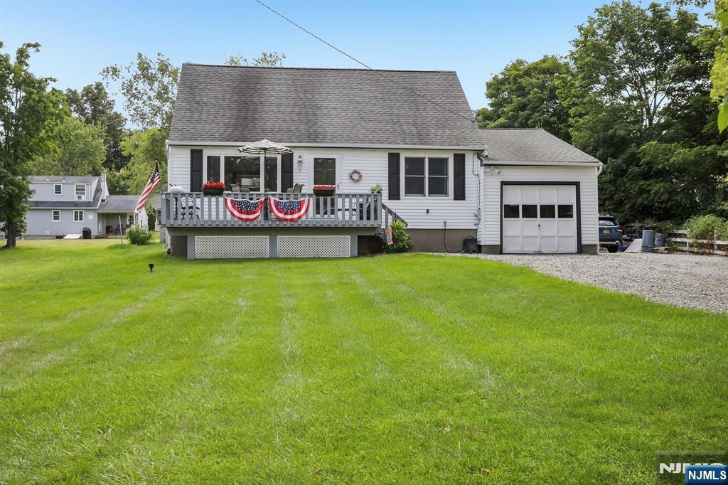 Immaculate and meticulously maintained home on quiet country lane. Eat in kitchen with stainless steel appliances and Corian counter tops, Hardwood floors. There are stairs to the spacious second floor. Rear dormer with windows and pre plumbed for heating. There's ample room for a primary suite or two bedrooms and a bath. Full basement can easily be finished. Front and rear deck are perfect for relaxing and entertaining. Beautiful rear yard. One car garage and driveway with plenty of parking. Located close to town center and shopping areas. County and state parks as well as Greenwood Lake are close by. This house is a gem in the heart of West Milford. Don't miss!