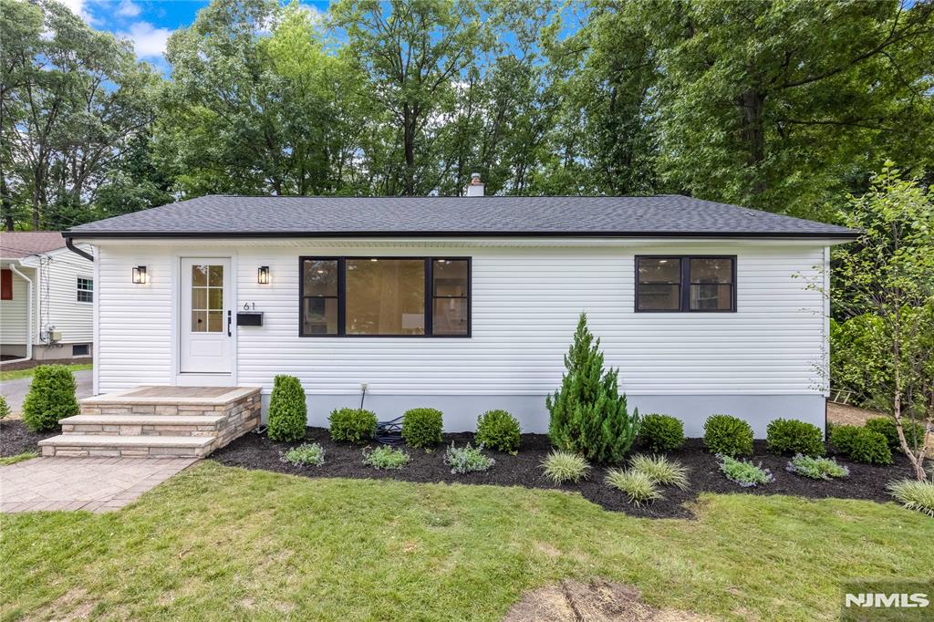 Completely renovated from top to bottom, this stunning 4-bedroom, 2-bathroom ranch is tucked away on a quiet dead-end street in a peaceful Waldwick neighborhood. The home has been fully gutted and beautifully renovated, inside and out, featuring brand-new siding, roof, HVAC, and more. Enter into the bright, open-concept kitchen, living, and dining area, designed for both everyday living and entertaining. The beautiful new kitchen features quartz countertops, stainless steel appliances, a breakfast bar, under-counter microwave, and a stylish range hood. Three bedrooms and a gorgeous full bathroom are conveniently located on the main level, offering true one-level living with no steps required to access a bedroom. The fully finished basement provides exceptional additional living space with a large recreation room, fourth bedroom with an egress window, and a second full bathroom. Enjoy the peaceful backyard and brand-new paver patio. There is absolutely nothing to do but move in and enjoy this beautifully renovated home. Waldwick offers a wonderful small-town community, highly regarded schools, and convenient access to New York City by nearby train and bus.