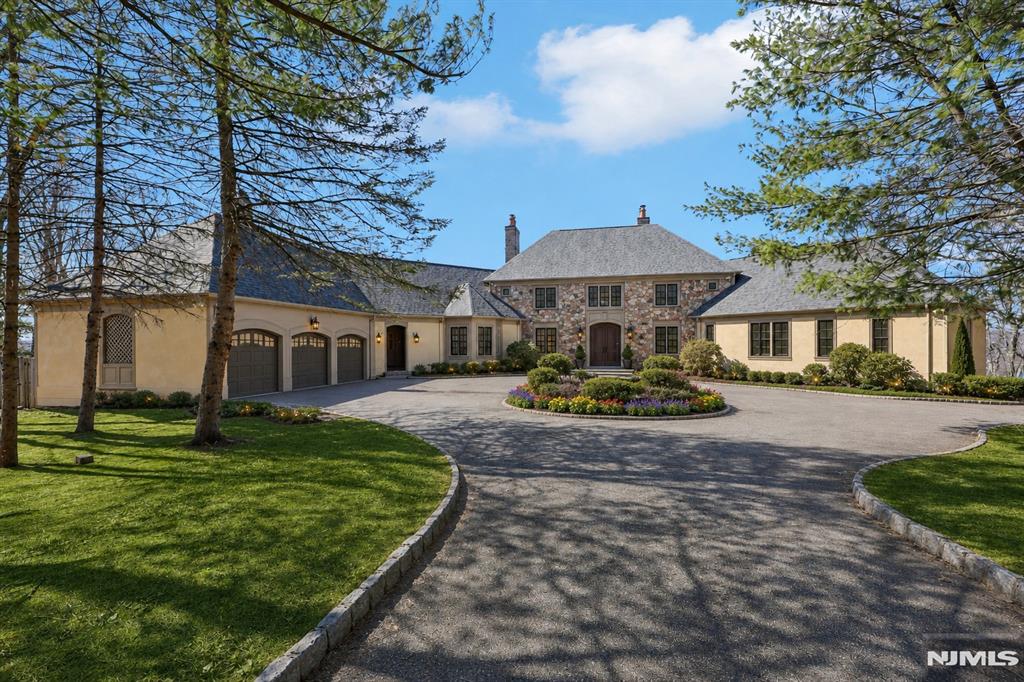 Welcome to luxury living in Smoke Rise, where this exceptional estate offers approximately 6,000 sq ft of refined living space w/magnificent views thru-out. Long private drive leads to a circular driveway & front entrance opens to a grand Foyer w/double guest closets. LR w/fpl, FDR w/sliders to a slate patio, expansive Great Rm w/fpl and additional patio access, perfect for seamless indoor-outdoor entertaining. Library w/marble fpl & Crawford ceilings adds timeless elegance. 1st flr Master Suite with walk-in closet and jetted tub, additional BR w/walk-in closet and fbth w/handicap-accessible shower. MEIK equipped w/center island, Corian countertops, pantry & sep din area, complemented by a Butler's pantry, Laundry Rm and 2 Powder Rms complete this level. 2nd flr offers BR w/fbth and oversized wlk-in closet, additional BR, Office, Art Studio, Sitting Rms, Bonus rms and another fbth. Huge Finished Bsmt expands the living space w/ a BR featuring a fpl and fbth, Rec Rm, Wine Cellar, Fitness area, additional fbth & 1/2 bth and an abundance of flexible living space. Additional highlights include walk-up attic, hardwood flrs under w/w carpeting, 2nd staircase, 3 car built-in Gar w/electric car charger and Sunroom leading to a private Backyard oasis with I/G pool. Enjoy resort-style living in the gated Smoke Rise community, offering 24 hr security, private 120-acre lake for swimming, boating & fishing, tennis, horseback riding, clubs, dining and year-round activities.