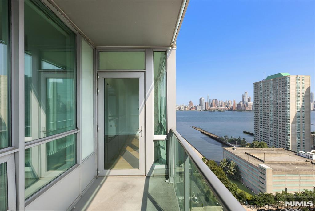 Welcome to this southfacing 1bed/1bath with a private balcony and NYC/river views in the Shore South. The open layout has gleaming hardwood floors and floor-to-ceiling windows that provide tons of natural light. Chef's kitchen features stainless steel appliances and a full breakfast bar. Spacious bedroom has large closet and spa-like ensuite bathroom. The full-service building offers 24/7 concierge, lounge, jacuzzi, sauna/steam room, conference room, fitness center, and rooftop deck. Conveniently located near the Hoboken and Newport Path, Newport Green Park, Morton Williams Super Market, shops, restaurants, and everything Newport has to offer. Pets ok. Move-in Date: 9/1.