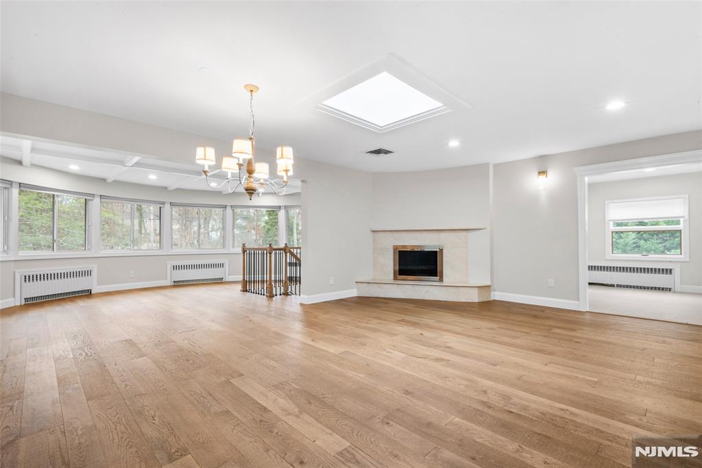 Nestled on the beautiful East Hill of Demarest, this property boasts over 2,000 square feet! It was designed as a large contemporary ranch with a professional home office and is situated in a multi-million-dollar neighborhood that offers an easy commute to NYC.