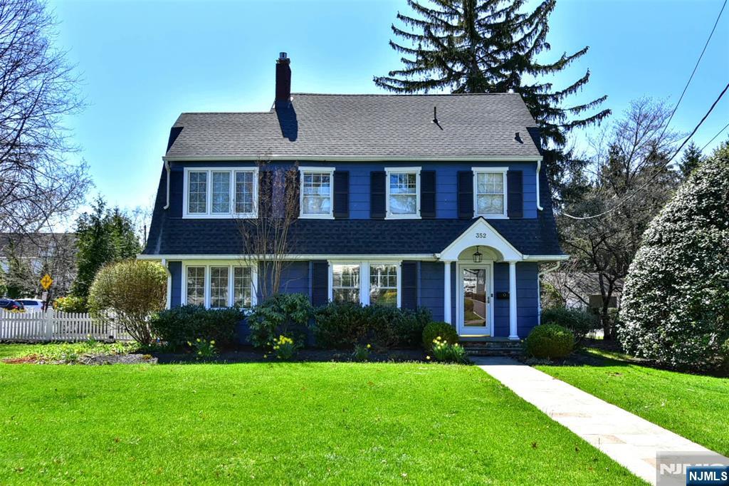 Welcome to 352 Fairway Road. From the moment you arrive you will be captivated by its inviting curb appeal & timeless design, Step inside this beautiful 4 bedroom, 3.5 bath residence & discover a thoughtfully designed layout filled with natural light & elegant finishes throughout. The spacious living areas offer the perfect setting for both everyday living & entertaining. The updated kitchen features quality cabinetry, granite countertops, SS appliances w/french doors that lead you out to an expansive blue stone patio & lush backyard for al fresco dining. Gracious Living RM w/gas fireplace, Den/Office w/custom built-ins, FDR w/coffered ceilings, french doors leading out your private oasis. Powder Room. The 2nd level features a Primary Suite w/2 WIC's & primary bath. Two additional BR's on this level with full Bath. The 3rd level features a 4th BR & full bath. Full basement w/rec rm. laundry, & storage. This home offers the perfect balance of suburban tranquility & urban convenience-a true place to call home. Minutes from Ridgewood's vibrant downtown, top ranked schools, fabulous restaurants, NYC transportation & scenic parks.