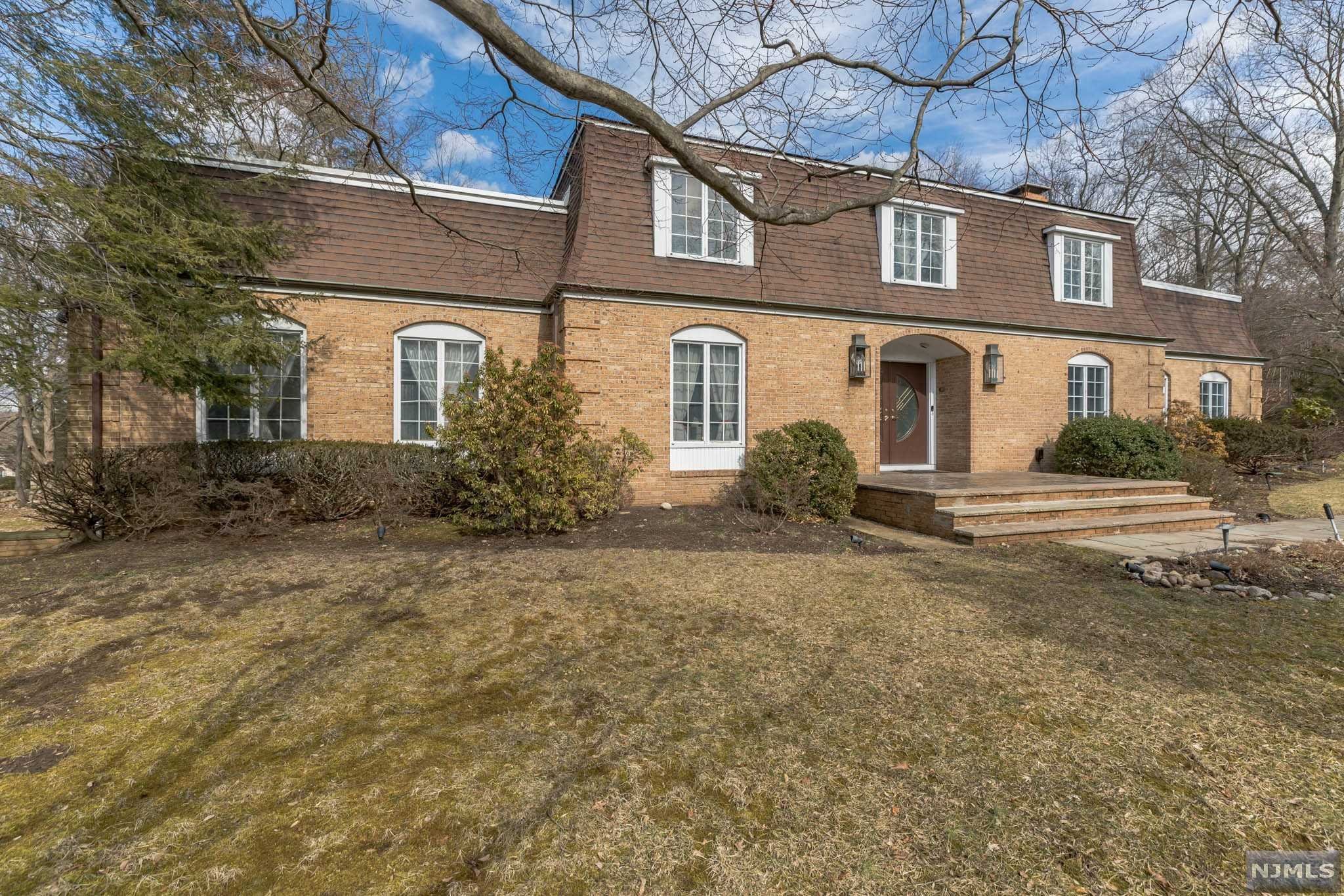 Welcome to this magnificent, custom-built, home office sitting in an all brick center hall colonial featuring 4 spacious bedrooms, 4.5 baths, an elegant formal dining room, great room, bonus room, and finished basement with 2 French drains. This property perfectly balances character and convenience with French doors, 3 zone HVAC, central vacuum, and 2 wet bars. Highlights include a sizable private driveway leading to an attached 3 car garage, all resting on approximately an acre lot, featuring a huge, manicured backyard. This spectacular home also includes a newly renovated professional office suite on the ground level which includes a reception area, 3 office rooms, and a separate 1st floor suite, and an expansive 16-space parking lot facing Wyckoff Ave. This is a can't miss opportunity for a work-from-home professional, in-law suite, or a savvy business owner.
