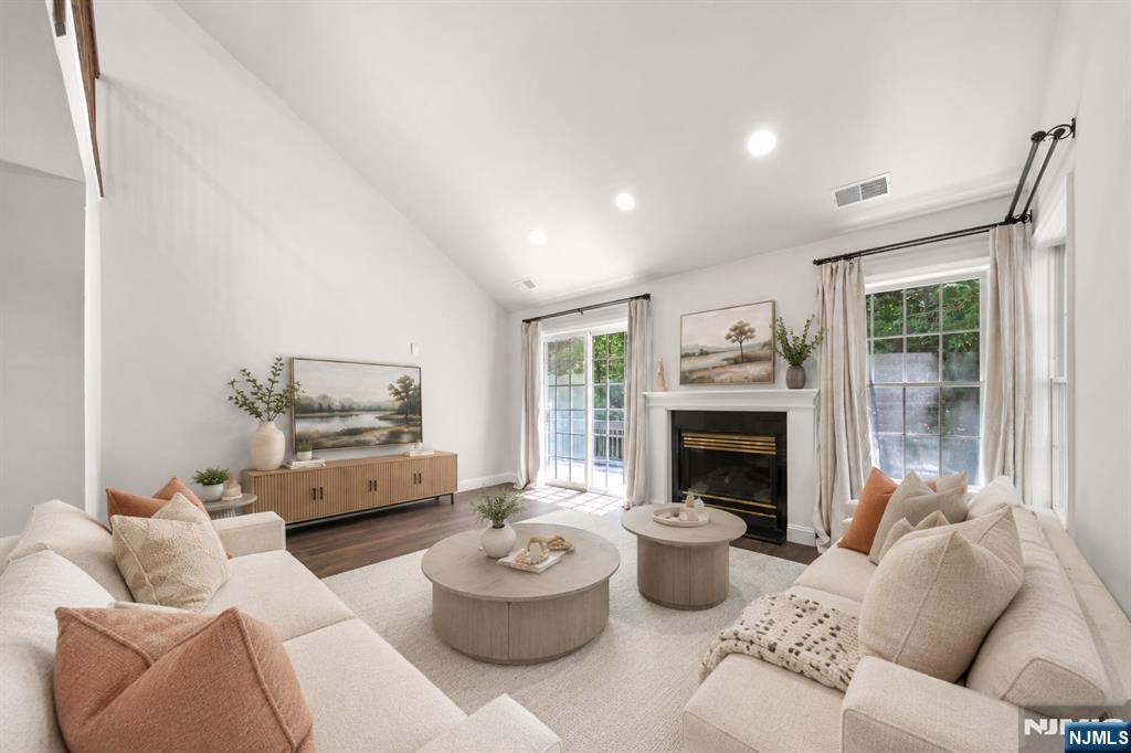 Welcome to an exceptional corner residence in the coveted Village of Old Tappan, offering approximately 2,272 sq ft of light-filled living space. The owners renovated this home as their own forever home, selecting only the finest materials and craftsmanship â€” the result feels less like a townhome and more like a private luxury retreat. Soaring ceilings, walls of floor-to-ceiling glass, and sunlight pouring across rich hardwood floors greet you at every turn. Extensive 2024 renovations include: fully renovated custom kitchen with premium finishes and sun-drenched breakfast area; all-new appliances (dishwasher, microwave, oven range, refrigerator, washer/dryer); top-quality flooring throughout; spa-inspired primary bath with soaking tub, glass-enclosed shower, and custom double vanity; updated main-level full bath; and brand-new central air and heating systems including outdoor compressor. A whole-house generator adds rare peace of mind, and exceptional efficiency keeps utility costs impressively low. The elegant living room with gas fireplace opens to a private balcony, while the upper loft â€” with full bath and walk-in closet â€” works perfectly as a third bedroom, guest suite, or office. Current HOA of just $329/month covers landscaping, snow removal, pool, health club, and tennis. All within the acclaimed Old Tappan Blue Ribbon school district, moments from NYC transportation. A home of this caliber rarely comes along.