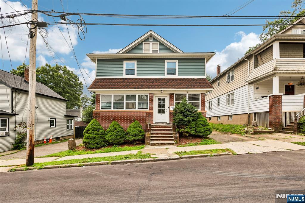 Whether you're looking to expand your investment portfolio or offset living expenses with rental income, this well-maintained 3 bedroom, 3-bathroom Multifamily home offers exceptional space, versatility, and value. Step into the inviting first-floor entry foyer leading to a sunlit living room that provides a welcoming space to relax or entertain. The living room flows seamlessly into the dining room, creating the perfect setting for everyday meals or gatherings. A large cased opening leads into the kitchen featuring custom cabinetry, a pantry, and ample counter space for meal preparation. The primary bedroom offers a peaceful retreat, while a full bathroom completes the first-floor unit. The second-floor unit features a comfortable living room flowing into the dining room, a spacious kitchen with custom cabinetry, ample counter space, and a dining area, plus two bedrooms, a storage room, and a full bathroom. A full walk-up attic provides abundant storage or future expansion potential. The partially finished basement includes a family room with a built-in bar and wood-burning fireplace, laundry area, storage, and a full bathroom. Step outside from the first-floor to find the rear deck, perfect for outdoor dining and entertaining and a backyard perfect for playing. The driveway provides ample off street parking. Conveniently located near NYC transportation, shopping, dining, and everyday conveniences, this versatile property offers outstanding value in a prime location.