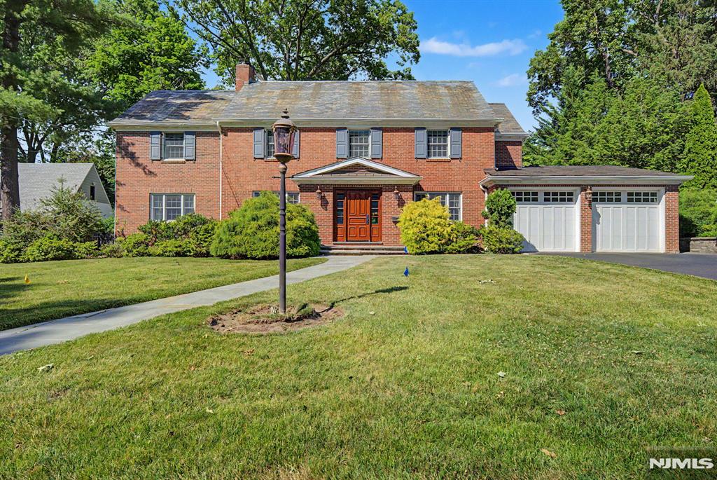 9 Woodland Park in Tenafly offers exceptional space, comfort, and versatility on a beautifully landscaped property in one of the townâ€™s most desirable neighborhoods. The home features an updated kitchen, expansive living and entertaining areas, mud room with dog shower and a luxurious primary suite with two walk-in closets. The finished attic, accessed by a staircase, provides valuable bonus space ideal for a playroom, office, or guest retreat. The lower level includes a separate gym along with additional finished space for recreation and relaxation. Mature landscaping and generous outdoor areas create a private setting with plenty of room for entertaining, recreation, or future enhancements.