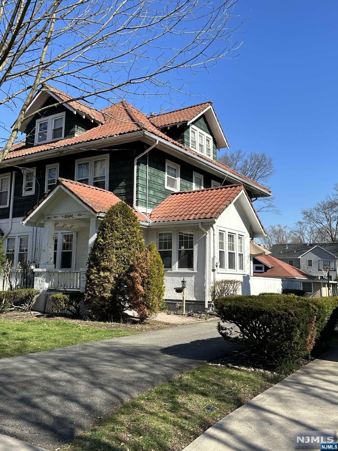 Incredible Value for this 3 Bedroom Attached Colonial home just minutes from the Picturesque Town Center of Westwood, with fine restaurants, shopping, and NYC bus and rail. You will LOVE the lifestyle this home offers. The property is 125 deep, with a wonderful rear yard and detached garage, PLUS a long driveway for ample parking. The home has an updated Kitchen with granite counters & stainless appliances. The Main Level boasts a Living Room, Dining Room, updated Kitchen, home office, and a Powder Room. The Bedroom level has 3 Bedrooms & a full bath. Enjoy the possibilities the Walk Up Attic has to offer, with lots of space! The finished basement has a full bath, laundry, recreation rm. Central A/C, a Covered front porch to watch the world go by, and the opportunity to live in this sought after town is exciting to imagine. Just a stroll to Trader Joes, restaurants and NYC bus and rail! Sold in As Is Condition!