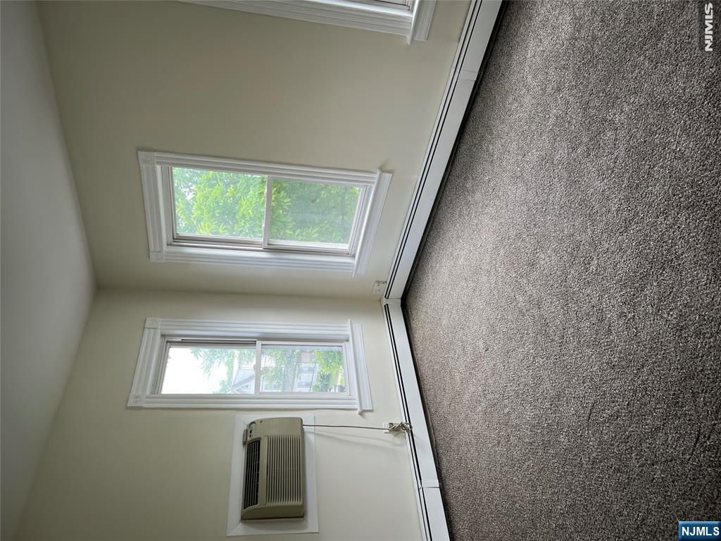 Two-Bedroom Second Floor Apartment in Kearnyâ€™s Desirable Arlington Section. Located on a quiet residential Magnolia street just steps from Kearny Avenue, this unit apartment features a bright living room, kitchen, two bedrooms, an walk-in closet, full bath, and in-unit laundry, attic storage. Freshly painted with new carpeting throughout, new stove, and microwave exhaust. Conveniently located within walking distance to Roosevelt School, shopping, restaurants, house of worship, and Kearny Avenue bus lines. Non-owner occupied. Street parking only. Unit includes the shared use of the yard, and storage in the garage. A must see!