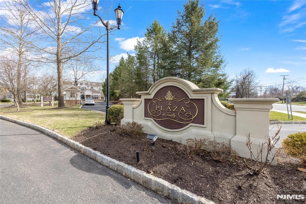 Elegant country-club lifestyle condominium in Tenaflyâ€™s highly sought-after Blue-Ribbon School District. This fully gated community features a spectacular clubhouse with a grand salon and fireplace, state-of-the-art fitness center, media/theatre room with stadium seating, entertainment lounge with billiards tables, catering kitchen, business center, and full-time concierge service. This southeast corner penthouse residence offers 10-ft ceilings and expansive windows that fill the home with abundant natural light. The kitchen is appointed with premium appliances. One indoor parking space (#213) and one outdoor parking space (#107) are included. Additional special assessment: $673.90/month till April 2026.