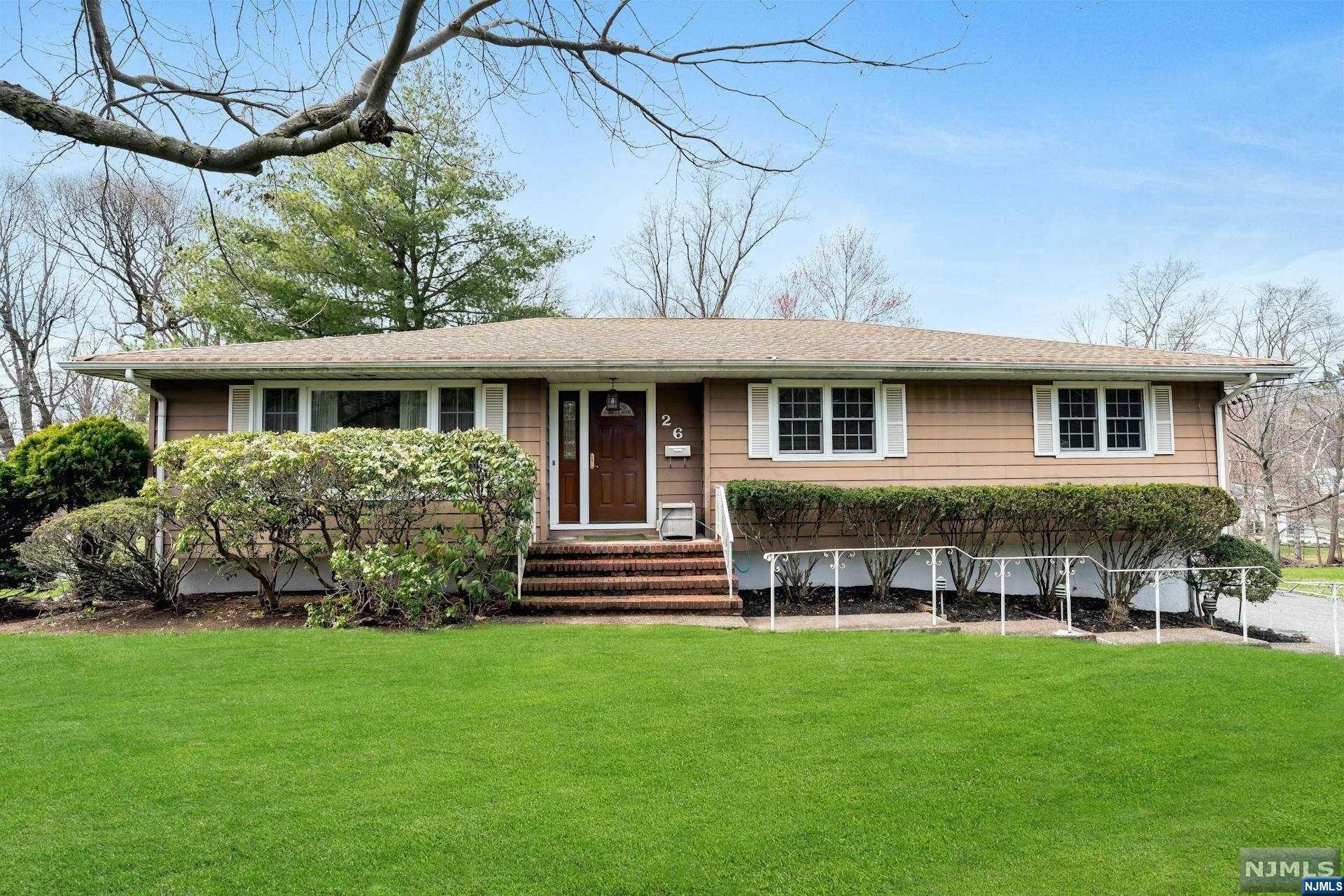 Presenting this exceptional mid-century ranch boasting 4-5 bedrooms, showcasing the timeless charm of its 1964 roots. Bask in the abundance of natural light that graces the expansive open floor plan. With a versatile layout, the possibilities are endless; envision open living/dining area, seamlessly connected to the eat-in kitchen and adjoining family room, which can easily convert into an additional bedroom, a primary suite with en-suite, along with two additional bedrooms and a hall bath. The fully finished lower level offers a generous flex space/family room, complemented by a bedroom/office, full bath, laundry room, and an attached oversized 2-car garage. Outdoor gatherings await on the dual-tiered deck, overlooking the private backyard retreat. This home is offered strictly in "as is" condition, inviting you to customize and transform it into your dream oasis.