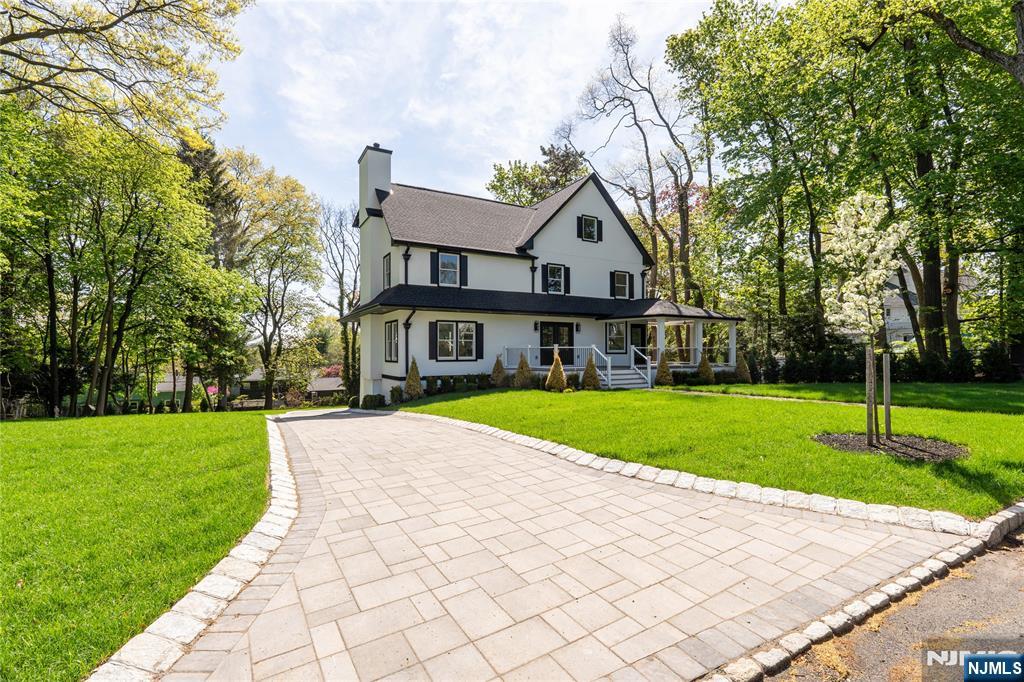 Luxury custom-built Colonial in Montclair offering luxury, comfort, and modern convenience. Priced at $2,700,000, this stunning smart home features 5 bedrooms, 4.5 baths, sophisticated finishes. The heart of the home is a designer chef's kitchen with Wolf appliances, Sub-Zero refrigeration, a wine refrigerator, and elegant finishes throughout. A beautifully oversized marble fireplace adds warmth and style, creating the perfect setting for both everyday living and entertaining. Designed for today's lifestyle, the home is equipped with a smart security system, 6 hard-wired cameras, and a full speaker system throughout both the interior and exterior, creating a seamless blend of luxury, comfort, and technology. Located in one of Montclair's most desirable communities, this home offers access to vibrant downtown dining, boutique shopping, parks, arts, culture, and convenient NYC transportation. A rare opportunity to own a truly special home in one of Northern New Jersey's most sought-after towns.