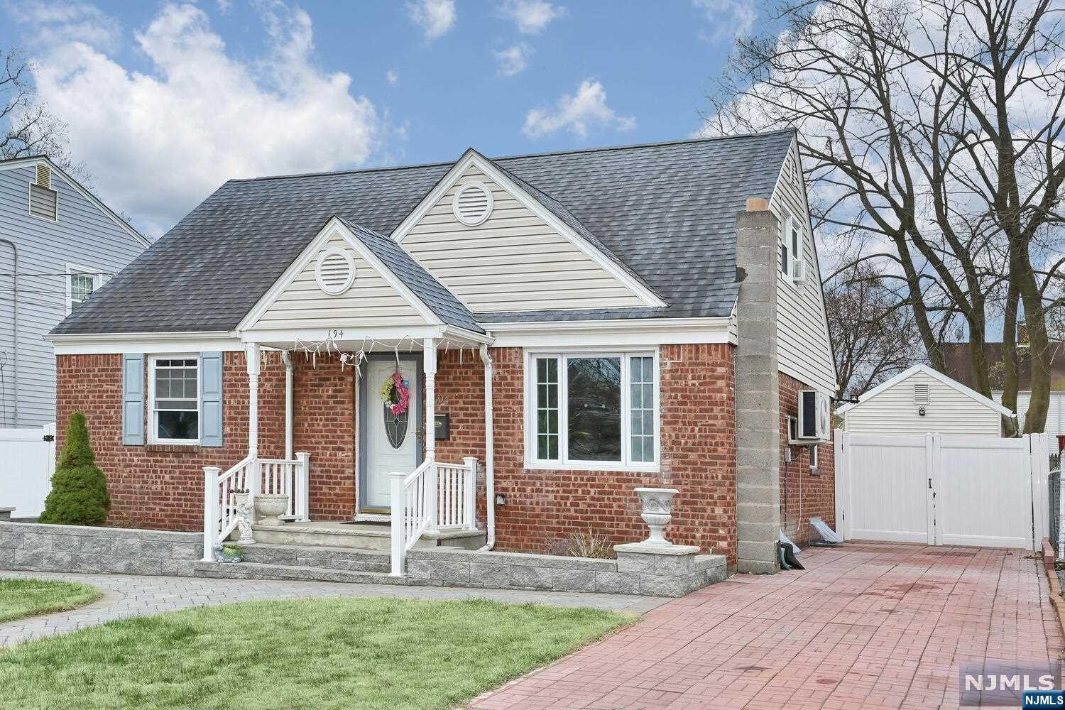 Fantastic Cape Cod home with gorgeous hardwood floors throughout. On the first floor you have a formal living room, dining room, bedroom, a granite & stainless steel updated kitchen, updated full bath and a great family room with sliders to private patio and fully fenced backyard. Second floor has two nice bedrooms. Basement is finished with rec room, laundry area, beautiful tile floors and a full bath with large shower. One car detached garage. Split unit A/C on first floor. Many recent updates, low taxes, walking distance to Washington Elementary School and NYC transportation. This home is a must see, don't miss it!