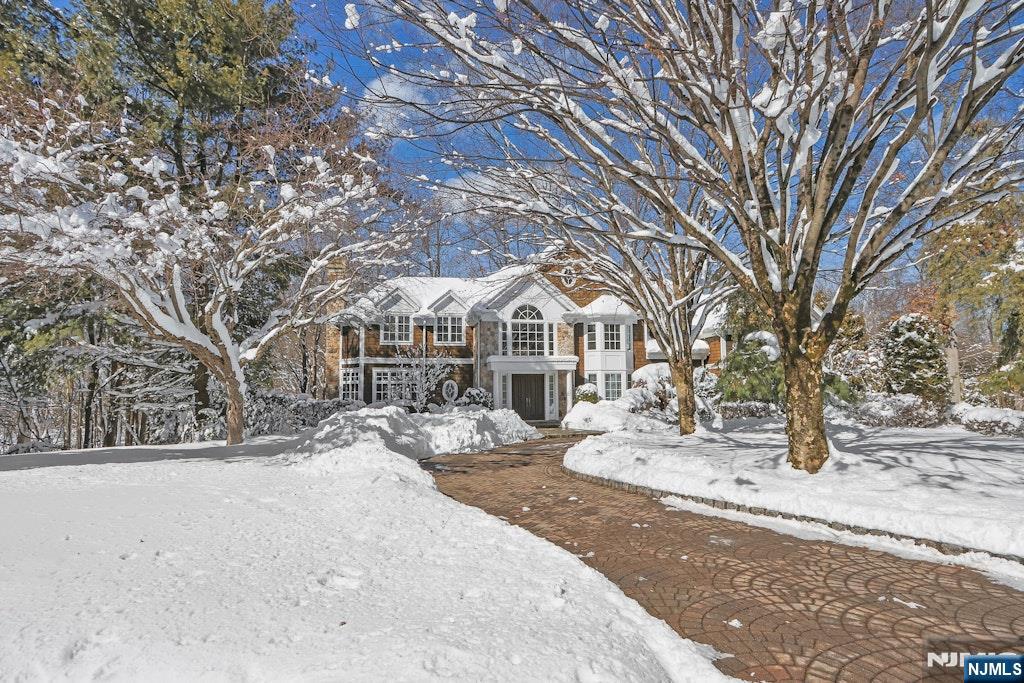 An exquisite Center Hall Country Colonial gracefully set on a serene cul-de-sac in the coveted East Hill enclave, encompassing 4.7 acres of breathtaking, park-like grounds. This distinguished residence offers approximately 6,000 sq ft of refined living space across the first and second levels, thoughtfully designed for both elegant entertaining and comfortable daily living. A grand two-story foyer welcomes you with soaring ceilings and an abundance of natural light, seamlessly flowing into the spectacular great room with equally impressive scale and volume. The homeâ€™s beautifully proportioned floor plan unfolds effortlessly, revealing a richly appointed library, a formal dining room ideal for hosting memorable gatherings, and a bright, impeccably positioned kitchen that opens to a warm and inviting family room. The main level also features a private bedroom and full bath perfect for guests or multigenerational living, along with a laundry room and an attached 3 car garage. Upstairs, the lavish primary suite serves as a true sanctuary, complete with a tranquil sitting room, an elevated office loft, a spa-inspired bath, and two walk-in closets. 3 additional family bedrooms and 2 well-appointed baths complete the second floor. The fully finished lower level enhances the homeâ€™s exceptional lifestyle offerings with a private movie theater, fitness studio, and spacious playroom, each with direct access to the rear grounds, seamlessly blending indoor luxury with outdoor beauty.
