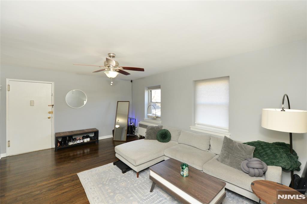 Bright and inviting first-floor corner condo in Hackensack! Enjoy warm hardwood floors throughout, a modern eat-in kitchen featuring granite countertops, stainless steel appliances, a smart fridge (2024), and a newer dishwasher (2025), along with an adjacent dining area. The spacious living room flows effortlessly to a full bathroom and a large bedroom with a double closet and abundant storage. This well-maintained building offers a designated parking space, on-site laundry, basement storage, and an on-site superintendent, providing everyday convenience and peace of mind. Ideally located just minutes from the New Bridge train station, approximately a 3-minute drive, with direct access to NYC and Hoboken, making commuting a breeze. Perfectly situated for comfort, convenience, and easy living! Maintenance includes SNOW REMOVAL, LANDSCAPING, COMMON AREAS, HOT AND COLD WATER