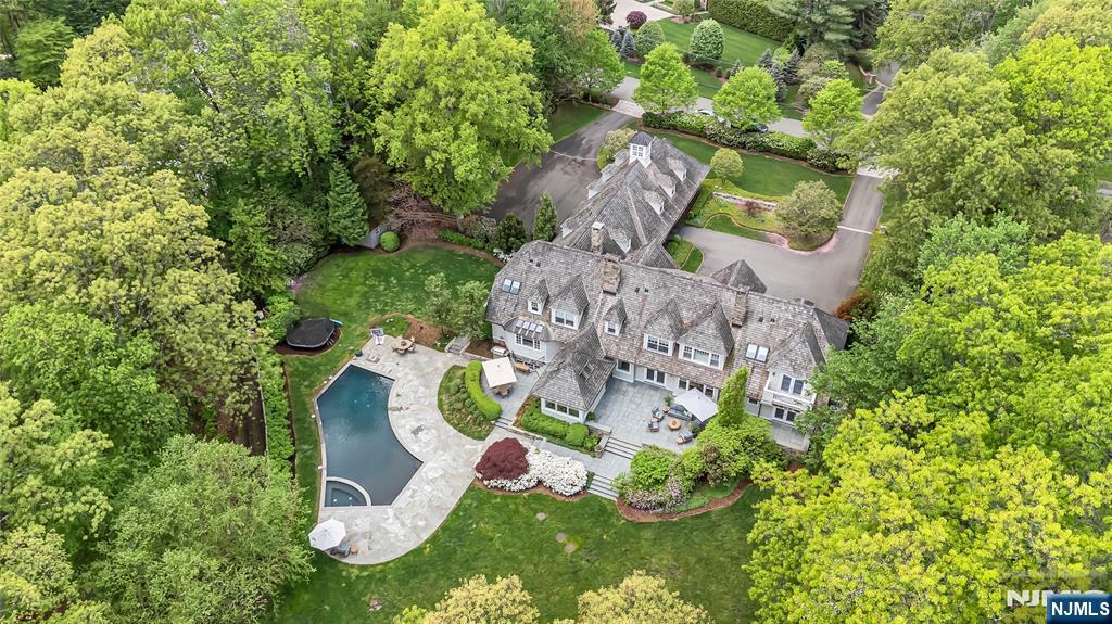 Experience elegance and comfort in this stunning 7,823 square foot custom-built estate, perfectly positioned on two acres of lakefront property. Offering incredible lake views and an expansive layout designed for both grand entertaining and everyday living this property is not to be missed. Relax in the expansive open-concept living room or bask in natural light from the stunning sunroom. Additional spaces include an inviting family room, a playroom, an intimate den plus a grand bonus roomâ€”perfectly suited for a private gym, game room, or personalized retreat. This home also boasts two fully appointed primary suites offering ample space for extended family living or visiting guests. Outside, relax or entertain in style beside the beautiful in-ground pool, all set against the serene backdrop of lake views. This extraordinary home offers a unique opportunity to own a private lakefront retreat with room to grow, gather and enjoy.