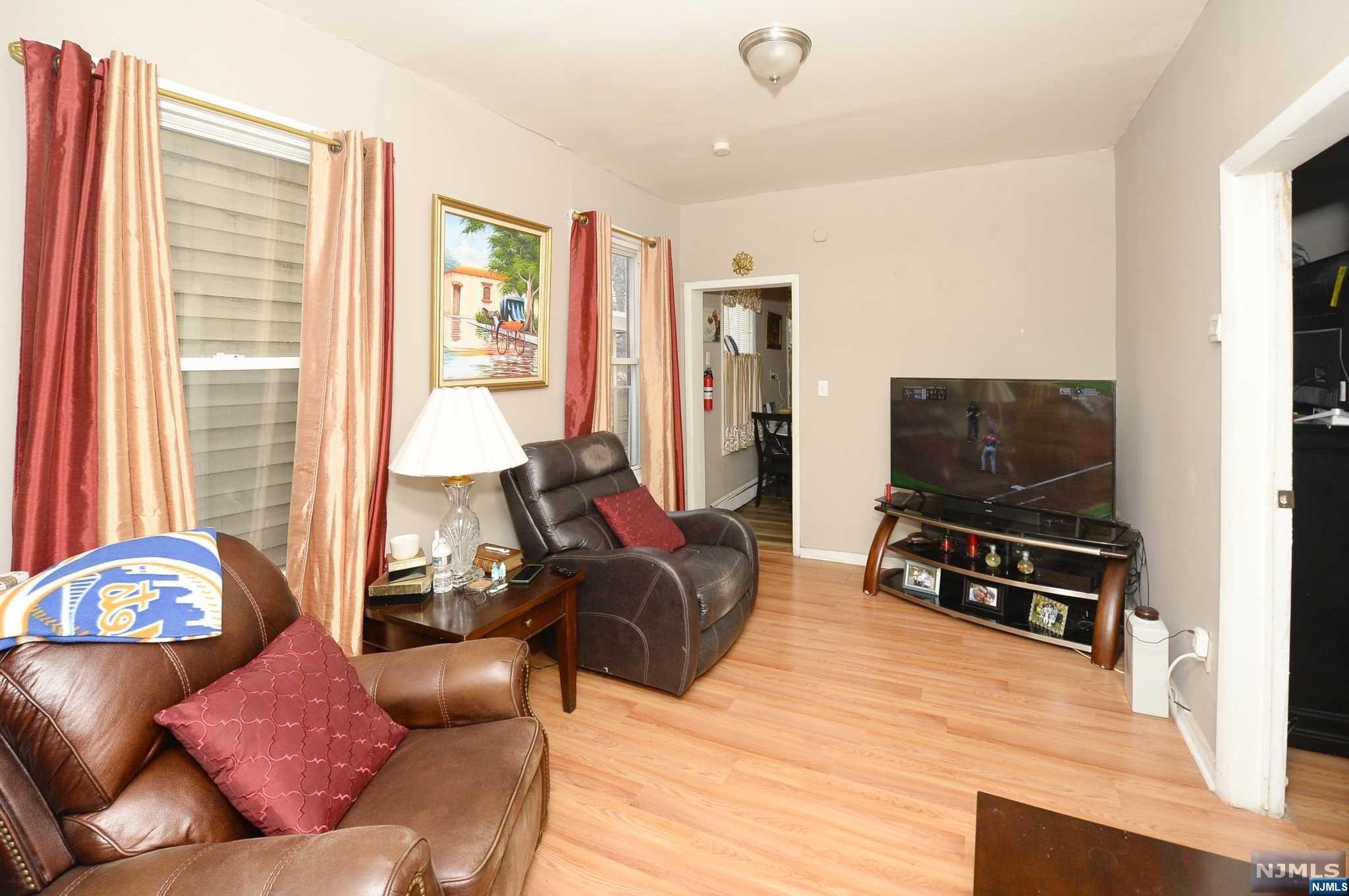 This expansive and versatile recently renovated legal 3 family, multi family home boasts three separate units, making it an excellent opportunity for those seeking rental income or for extended living who want to live close to each other. Unit 1 is a spacious 3-bedroom, 1-bathroom apartment, large living room, dining area, and a kitchen. Unit 2 offers 3 bedrooms and 1 bathroom, complete with a living room, dining room, and kitchen. Unit 3 offers 2 bedrooms and 1 bathroom, featuring a spacious living room, dining room, den, and kitchen. This property has adjoining vacant lot with potential to be subdivided or even potentially a new build! The home also features a basement, offering additional storage space and backyard/ garden. Home features all separate utilities. This multi family home is conveniently located near shopping, dining, major highways and public transportation. CALL MICHAEL W/ QUESTIONS 201-925-1908