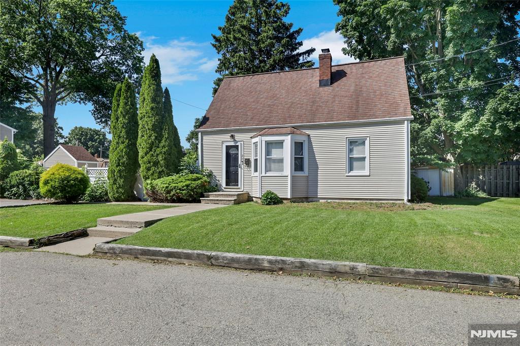 Charming 4 bedroom cape cod home located on a quiet dead-end street steps away from Pompton Lake. Perfect condo alternative or possible future expansion. Features include: Updated eat-in kitchen with stainless steel appliances, solid wood cabinets and tile backsplash. Living room with wood floors, bay window and wood-burning fireplace. First floor offers an updated full-bath, laundry area and two cozy bedrooms. 2nd floor offers primary bedroom w walk-in closet and additional bedroom. Utilities accessible through exterior Bilco door to partial unfinished basement. This home/property is not located in the flood zone Conveniently located close to Oakland border, Rout 287, schools and shopping.
