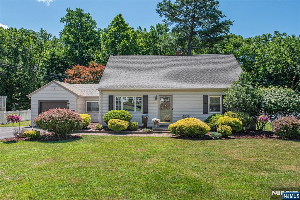 Beautiful Curb Appeal In This Charming 4 Bed 2 Bath Cape Cod In One Of Wayne's Most Desirable Locations! Enter The Welcoming Living Room That Leads To The Stylish Updated Eat In -Kitchen With White Cabinets, Subway Tile Backsplash,Quartz Counterstops & SS Appliances. Two Bedrooms On The First Floor With Hardwood Flooring & Updated Full Bath. Cozy Breezeway To Relax In w/ French Doors.The Second Floor Offers Two Additional Bedrooms & BathRm w/ Newly Updated Stall Shower. Full Unfinished Basement With Laundry & Workshop. Private Backyard With Spacious Deck For Entertaing! Large Storage Shed & Attached Garage & Driveway w/ Parking For 6+ Cars. Close To Schools, Shopping, Town Pool, Library & NJ Transit Brand New Roof June 2026! Brand New Interior 6 Panel Wood Doors! Won't Last!