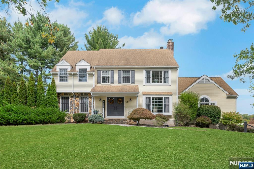 Tucked away on a quiet horseshoe block in the sought-after Hartley Estates neighborhood, this pristine five-bedroom center hall colonial blends elegance with everyday comfort. The professionally landscaped grounds showcase a sparkling in-ground pool perfect for summer gatherings and serene relaxation.Step inside to a gracious foyer that opens to a stunning kitchen, outfitted with top-of-the-line appliances: a Viking refrigerator, Thermador oven, farm sink, and rich plank wood floors. The kitchen flows seamlessly into a magnificent great room with cathedral ceilings and a striking brick fireplace, creating the heart of the home.Glass doors from both the kitchen and family room lead to a spacious deck, overlooking the beautifully manicured backyard a true indoor/outdoor retreat.The layout offers incredible flexibility with a bedroom conveniently located on the first floor perfect for guests or a home office.Upstairs, the primary suite is your private sanctuary, complete with its own fireplace, spa-inspired bath, and custom walk-in closet. 3 more bedrooms complete the second floor. All bathrooms in the home have been recently renovated, combining timeless design with modern function. Hardwood floors run throughout, adding warmth and sophistication to every room.A fully finished basement offers additional living space, home gym, play area, ample storage, a dedicated workshop, and a two car attached garage. Conveniently close to shopping, dining.