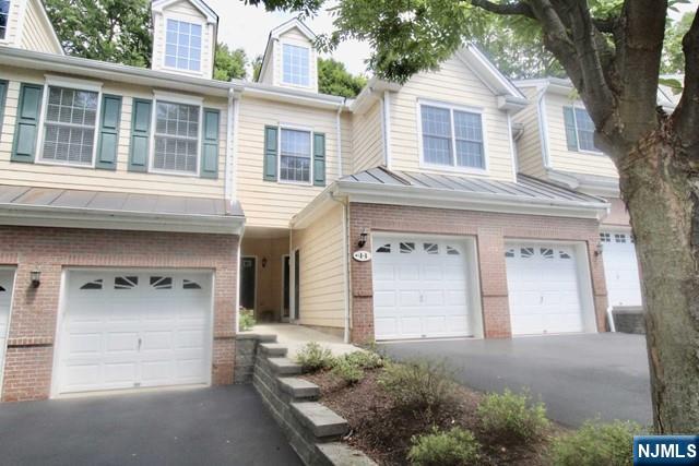 Updated 3 bedroom, 3 bath townhouse in Pine Lake Village. The inviting living room features vaulted ceilings and sliding glass doors to a quiet and private 2nd floor deck. Continue with an open floor plan to the modern kitchen with stainless steel appliances and granite countertops. Dining room features vaulted ceilings. The living area is complete with laundry, bedroom and full bathroom. The large master bedroom features double closets, a master bath with a whirlpool tub and marble floors and countertops. The top floor features a loft, Bedroom and full bath, with wooded views. The unit includes a large, approx. 900 sq. ft. basement, one car garage and parking space. Enjoy the quiet and serene setting with the Poplar Rd. Wildlife Sanctuary across the street. Pets conditional, only one under 25 lbs permitted.