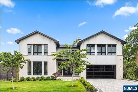 NEW CONSTRUCTION MODERN STYLE. OPEN FLOOR PLAN WITH 9FT. CEILINGS ON THE FIRST FLOOR. TWO STORY EF AND FAMILY ROOM WITH FIREPLACE, LARGE KITCHEN/DINING AREA, WITH QUARTZ ISLAND AND COUNTER TOPS, ALL STAINLESS STEEL APPLS, SUB-0 REFRIGERATOR. ALL BEDROOMS WITH EN SUITE BATH WITH RADIANT HEAT. PRIMARY SUITE WITH LARGE BEDROOM, FIREPLACE, LARGE CLOSETS, AND BATH WITH GLASS STALL SHOWER AND FREE STANDING BATH TUB. FIN BASEMENT WITH REC.ROOM WITH WET BAR, 1 BEDROOM, 1 BATH AND SLIDING GLASS DOOR TO YARD. OAK FLOORING, CUSTOMING CEILING AND STAIRWAY LIGHTING, PORCELANOSA, SPEAKER SYSTEM,CAMERA SECURITY, C/AC,VAC, 3 CAR GARAGE, LANDSCAPING, GENERAC GENERATOR. CONTEMPORARY DESIGN, DEEP YARD AND A GREAT QUIET LOCATION. PREMIER BUILDER, BUILDING LUXURY HOMES SINCE 1981.