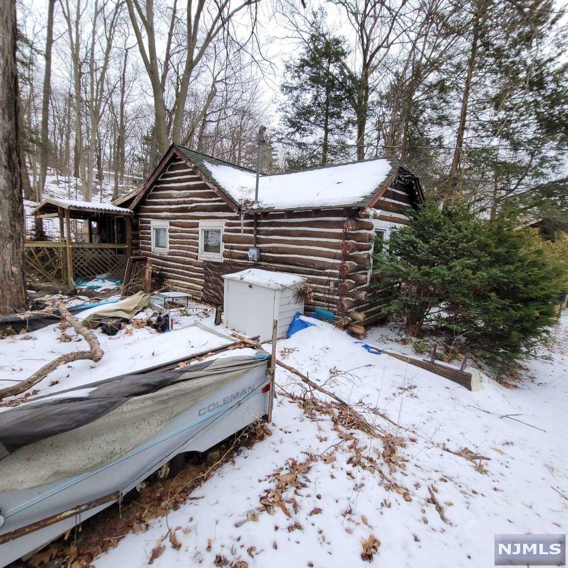 Investor Alert - AS IS WHERE IS log cabin (2 bedrooms, 1 bathroom on almost 1/2 acre. Cash offers only. Buyer responsible for all repairs, certs, etc.
