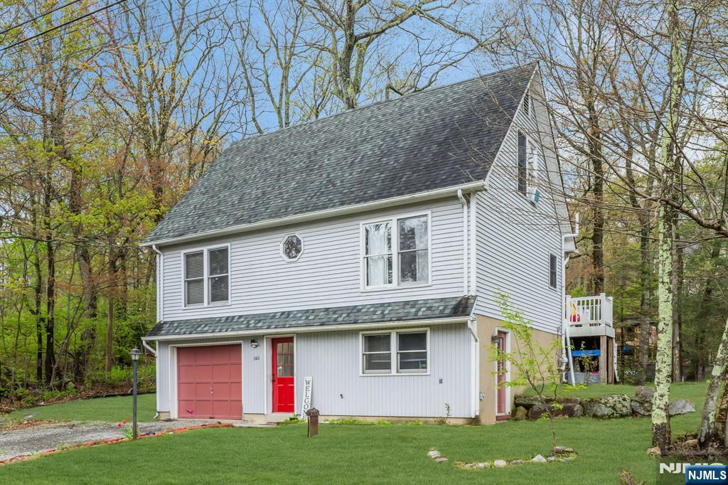 Great opportunity to own in Upper Greenwood Lake! This 3-bedroom, 2 full bath home offers a flexible layout with an additional room perfect for an office or den, plus a spacious ground-level family room with its own private entrance. The oversized deck is great for entertaining or relaxing outdoors, and the 1-car garage provides added convenience. Located near the New York border and just minutes from Warwick, NY, enjoy easy access to hiking, boating, fishing, and year-round outdoor activities. Close to wineries, breweries, orchards, farms, local shops, and Mountain Creek skiing. Mandatory annual lake easement fee applies. Beach/lake membership is optional. OPEN HOUSE Sunday 5/9 from 1 to 3pm.