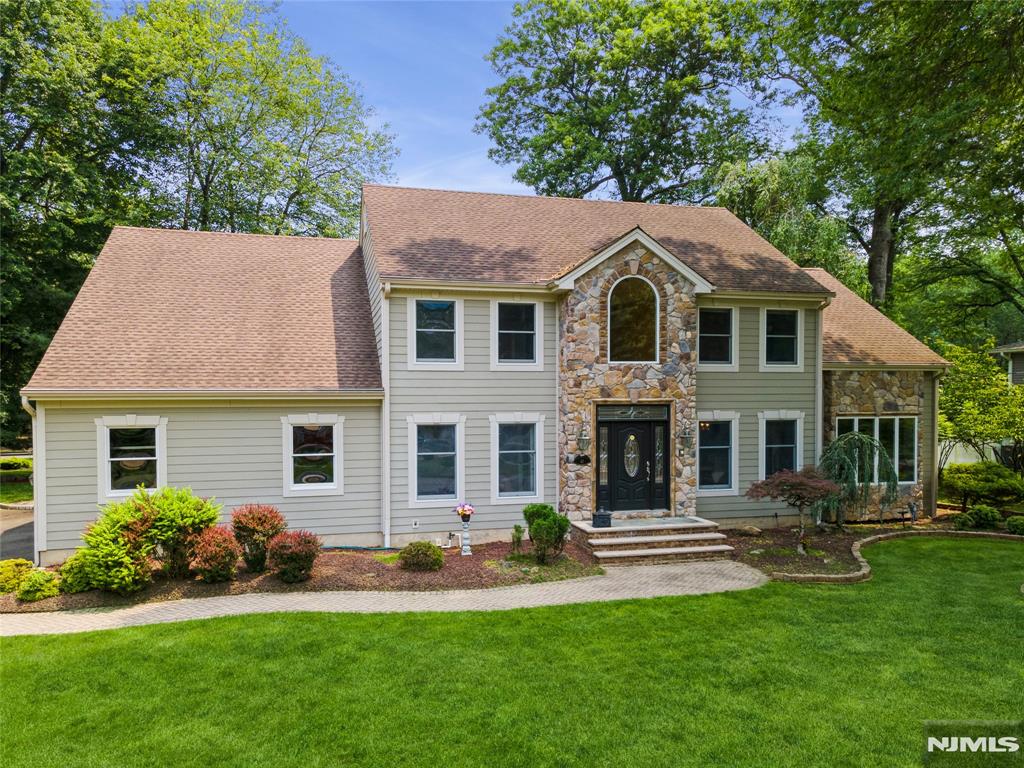 Sought after neighborhood! Stunning 5 Bedroom 3.5 bath CH Colonial with a 3 car garage is nestled at the end of a cul-de-sac in the desirable town of Harrington Park. This is the home youâ€™ve dreamt about and wished for. Meticulously cared for by the original owners. Glistening Hardwood Floors t/o. Boasts beautiful and spacious interiors (3412 approx.)with amazing landscaping, creating an ideal setting for both relaxing and entertaining.Exterior features Hardie Plank with distinctive stone work . Welcome home : 2 Story EF with sweeping staircase, chevron design wood flooring and lovely chandelier. FLR: A sun-filled space designed for both comfort and style. Elegant FDR: Spectacular front to back sunken, Family Room with impressive granite fireplace hearth, memories will be made here. Custom EIK with extensive cabinetry, granite countertops,center island, separate bar countertop with additional sink, newer SS appliances. Sliding glass doors lead to the private patio and serene yard. Pantry. Powder Room.Laundry. 2nd Level: Primary Bedroom with WIC, Lux Updated Bathroom with skylight, 2nd Primary Bedroom with WIC, additional storage rm, Full Updated Bath with skylight , Bedroom with vaulted ceiling, Bedroom. Full Bath with Skylight. Basement: Rec Room, office/gym space, Storage, utilities. A host of updates-2 Units A/C system 2010,GAF Roof 2010 w 30 yr warranty. Note: Top Rated Schools, Close to Park and Tennis court. Bus to NYC. Dreams do come true in Harrington Park.. H&B DUE