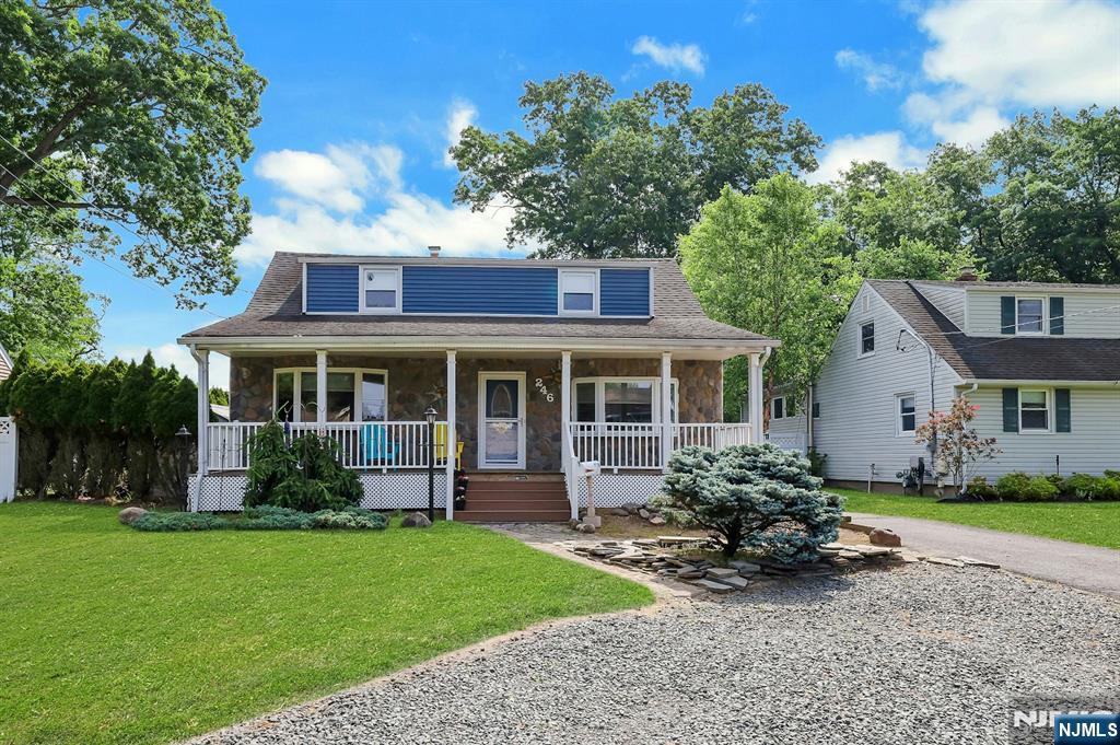 Immaculate 3-BR Home with Charming Lemonade Front Porch in the Heart of River Vale! Welcome to this beautifully maintained home featuring timeless charm and modern updates throughout. Step into the spacious foyer leading to a formal dining room and a bright, inviting living room. The spacious eat-in kitchen boasts warm wood cabinetry, a center island, stainless steel appliances, and a convenient mudroom with access to the backyard. A full bath completes the first level. The second floor offers three generously sized bedrooms and a full bath. The lower level provides additional living space with a recreation room, laundry area, and ample storage. Set on a lush, professionally landscaped property, the outdoor space is perfect for relaxing and entertaining with a fully fenced yard and expansive deck. A large detached garage offers incredible versatility with additional storage or potential office space. Ideally located close to top-rated schools, parks, restaurants, and shopping, this charming River Vale home is a must-see!