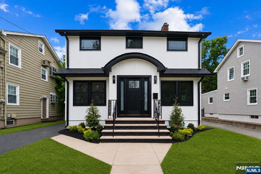 Completely renovated from top to bottom, this stunning 3-bedroom, 2.5-bath home seamlessly blends modern style, quality craftsmanship, and everyday comfort. Thoughtfully redesigned with today's buyer in mind, the home features an open and inviting floor plan, wide-plank hardwood flooring, designer lighting, custom accent walls, and premium finishes throughout. The beautifully appointed kitchen serves as the heart of the home, showcasing quartz countertops, custom cabinetry, stainless steel appliances, and a center island ideal for gathering and entertaining. The spacious living area is highlighted by a striking fireplace feature wall, creating a warm and sophisticated focal point, while large windows fill the home with natural light. Upstairs, generously sized bedrooms provide comfortable accommodations, including a serene primary suite. The beautifully updated bathrooms feature custom tilework, contemporary fixtures, and spa-like finishes. The fully finished basement offers valuable additional living space, perfect for a recreation room, home office, gym, media room, or playroom. Every detail has been carefully curated, creating a truly move-in-ready home that offers the style and functionality today's buyers desire. Ideally situated in the heart of Nutley, this exceptional home is just moments from vibrant downtown shops and restaurants, beautiful parks, local favorites, and quick access to major highways and NYC transportation, making it the perfect place to call home.