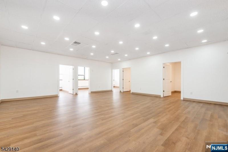 This beautifully renovated third-floor suite offers a bright, open layout featuring a generous central common area surrounded by 5 private perimeter offices. The setup is ideal for professional firms, medical practices, or collaborative teams. All utilities are included in the lease rate with no NNN surprises, and on-site parking is provided at no additional cost.Conveniently located just blocks from Route 280 and the NJ Transit station, the building is only two stops from New York Penn Station, offering exceptional accessibility for staff and clients commuting from across the region. An added bonus: on-site daycare on the ground floor makes this an outstanding choice for working parents.