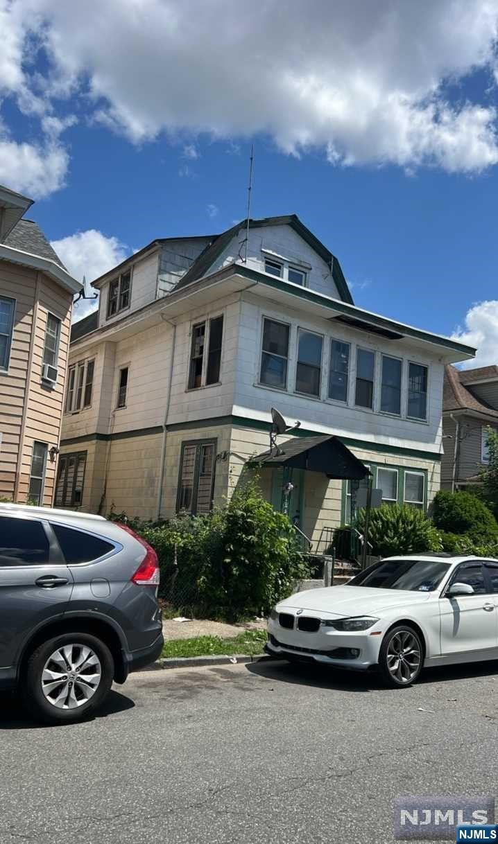 3 large units approx 4434sf needs complete renovation and being sold "as is", det 2 car garage, 50X100 LOT, great location and potential! Bring your imagination! Use caution to show, must sign mold disclosure prior to access. No utils are on, bring flashlight and use caution. **seller will respond to offers after 10 days on MLS.