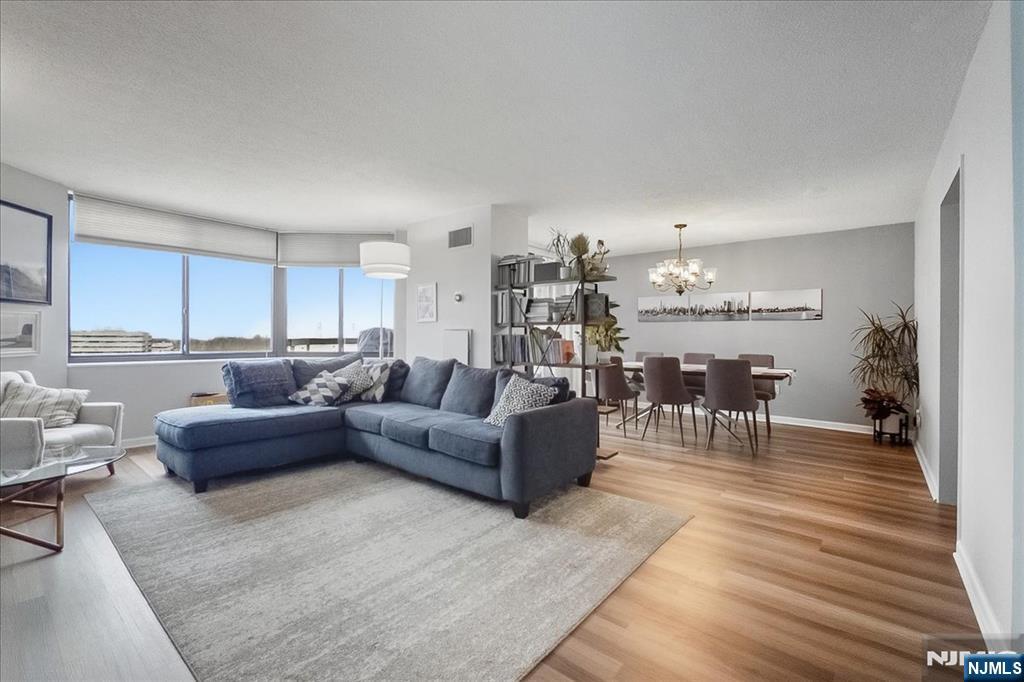 Spacious 2BR/2BA simplex with river views in desirable Harmon Cove Towers in Secaucus. Bright open layout with eat-in kitchen, living and dining room/area, plus a private terrace perfect for relaxing or outdoor dining. The primary suite features a walk-in closet with custom organizers and a private full bath. Second bedroom and guest bath located down the hall. Smart Home throughout the home except for Kitchen. Full-service community amenities included in HOA: 24-hour doorman, elevator, fitness center, outdoor pool, tennis and basketball courts, community room, deeded parking, and guest parking. Convenient NYC bus at the doorstep and free shuttle to the train station, ideal for commuters with easy access to Route 3 and the NJ Turnpike.