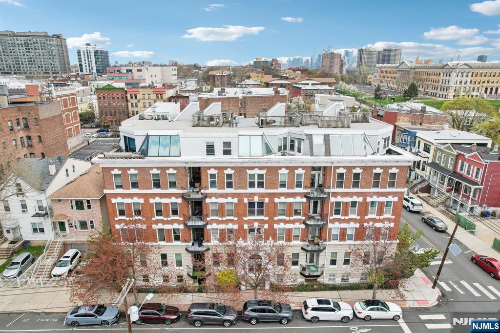 Uncover charming city living in this delightful condo (Unit 1-6) nestled in a classic brick building in the heart of Journal Square. This 1-bedroom, 1-bathroom home combines comfort and convenience across two thoughtfully designed levels. Upstairs, youâ€™ll find a stylish kitchen outfitted with granite countertops, stainless steel appliances, and easy-to-clean tiled flooring. The bright living area features hardwood floors and a cozy faux fireplace, perfect for relaxing or entertaining. Downstairs, the spacious bedroom offers a delightful retreat, along with a full bathroom, in-unit washer and dryer, and generous closet space. Location is everything, and this condo deliversâ€”just three blocks from the Journal Square PATH station and multiple NJ Transit bus lines, making for a seamless commute to Manhattan. Enjoy easy access to local public and private schools, gyms, restaurants, music venues, and places of worshipâ€”all just a short walk away