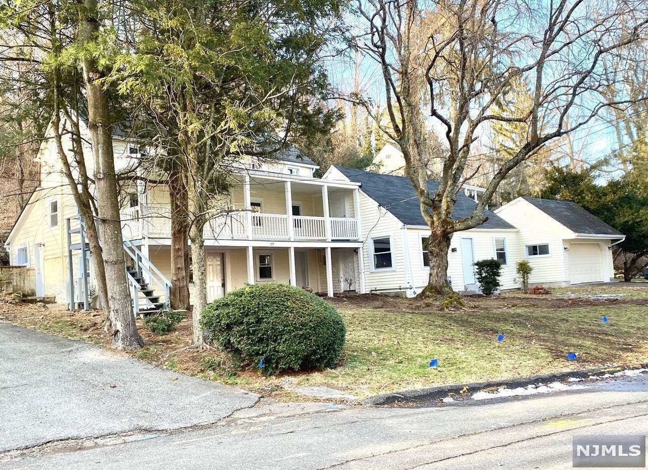 New price! Nicely updated SFH in sought after Woodcliff Lake. Great schools! This property can be used as 2 units like an extended family suite with two separate entrances. The property features 2 kitchens, 4 bedrooms and 2.5 bathrooms. All New windows, dual HVAC (gas furnace plus brand new split systems), New Granite countertops & New Stainless Steel kitchen appliances for both kitchens. Ceramic tiles and Hardwood floors throughout. Updated bathrooms. Freshly painted. Front Porch. New gutters with guards. Two car attached garage. Easy commute to NYC and major roads. Property is move in ready. Sold as is.