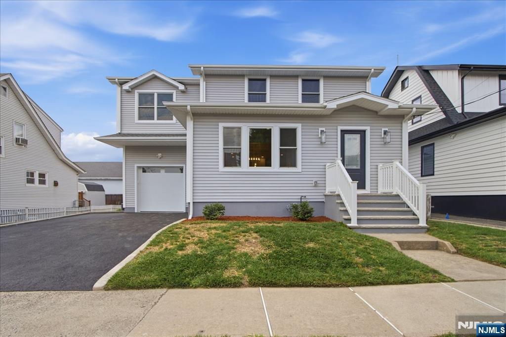 Completely renovated custom colonial with 4 beds, 2 1/2 baths. Large addition put on totaling over 2500sqft. 1st floor features an open concept with large eat in kitchen, custom cabinets, center island with quartz counters, high end appliances including wine fridge, living room, dining room, family room and powder room complete this floor. 2nd floor features a primary bedroom with walk in closet and a full luxurious bathroom. 3 additional bedrooms, full bathroom and laundry complete this floor. Full finished basement perfect for recreation room or additional living space. Large yard with privacy fence. Additional amenities include oversized garage with high ceilings, new roof, new Anderson windows, new multizone central air/ heating, new plumbing, new electrical, hardwood floors, crown molding. Conveniently located near restaurants, shops, schools, major highways and NYC transportation. Nothing to do here and a must see! Privacy fence being installed.