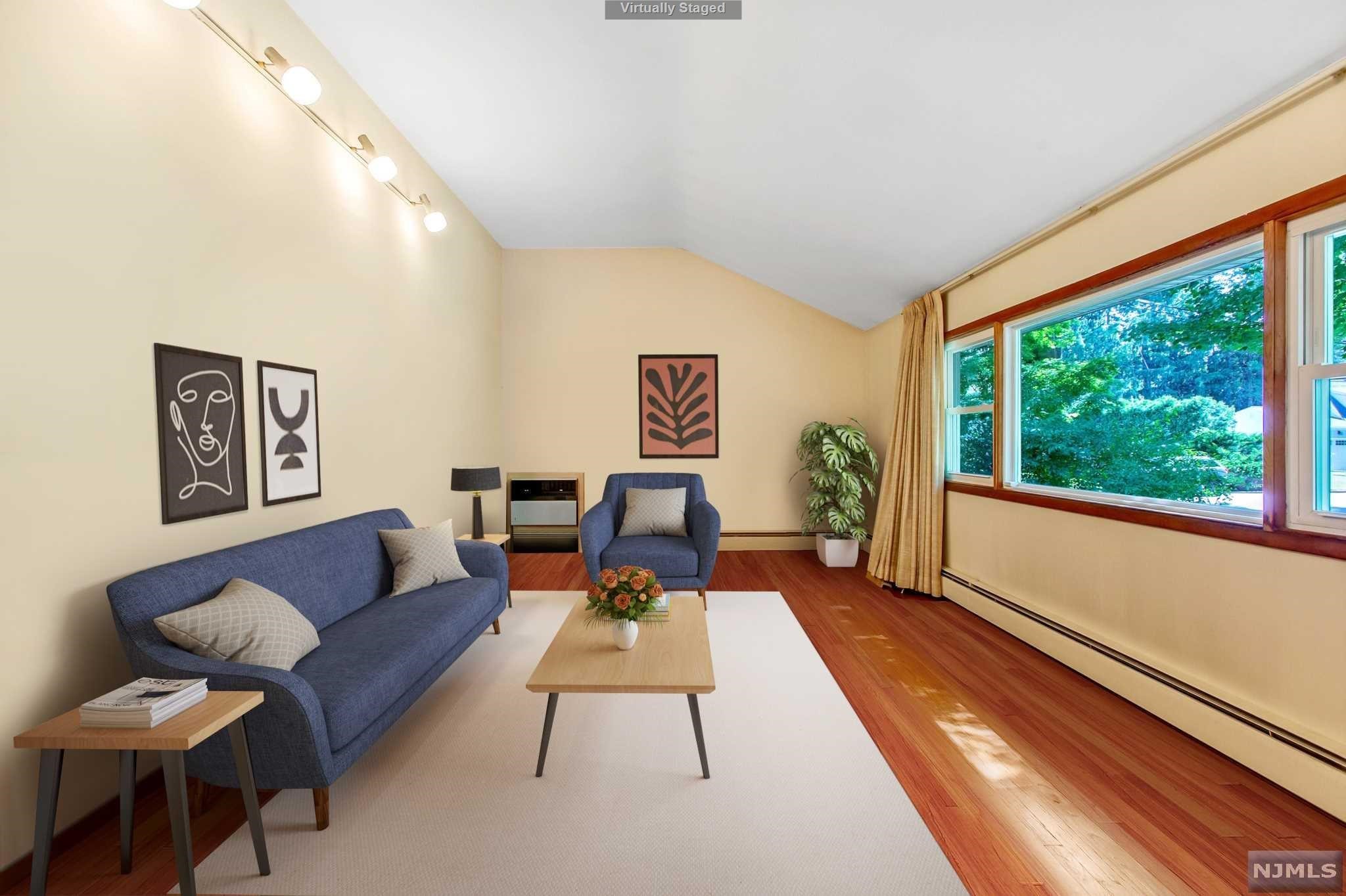 Outstanding Value! Set on on a quiet residential street of beautiful homes, this renovated California Split Level offers a top location, lovely layout & wonderful space both inside & out. The Cathedral Ceiling Great Room & Dining Room have beautiful hardwood floors, & offer incredible entertaining opportunities alongside the luxuries of everyday living. The recently renovated Eat-in Kitchen boasts granite counters, beautiful cabinetry & stainless appliances. The Entry Foyer opens to the main level Family Room boasting a lovely bay window overlooking the picturesque front yard. An Upper Balcony overlooking the Great Rm leads to the Bedroom Level, featuring a large Primary Suite w/updated Primary Bath & two additional bedrooms & Stunning Main Bath. The Lower Level boasts a Recreation Rm, storage area & additional access to the two car garage. It's Located just a stroll from the picturesque town center w/fine Restaurants! Top Rated Schools. EZ NYC Commute by car, bus & rail!